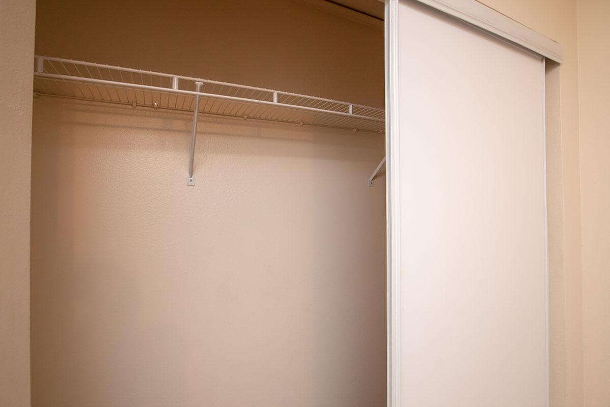 a white refrigerator freezer sitting inside of a building