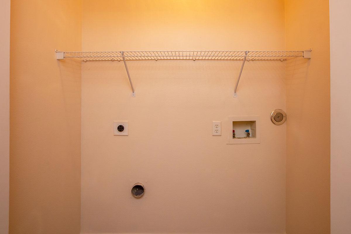 a white sink sitting next to a shower