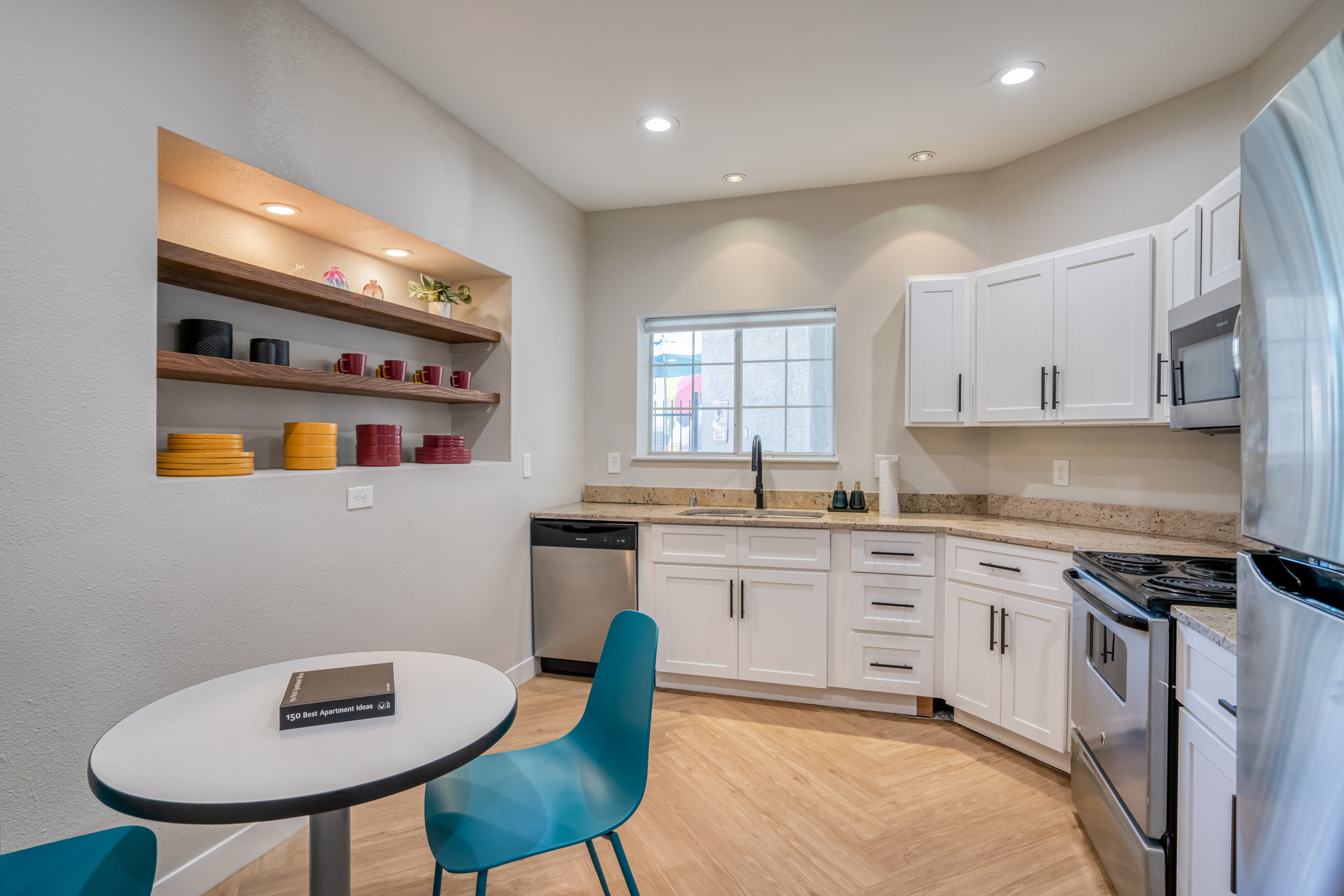 Fully-equipped clubhouse kitchenette and dining table in Leasing Office at Prisma in Albuquerque, NM