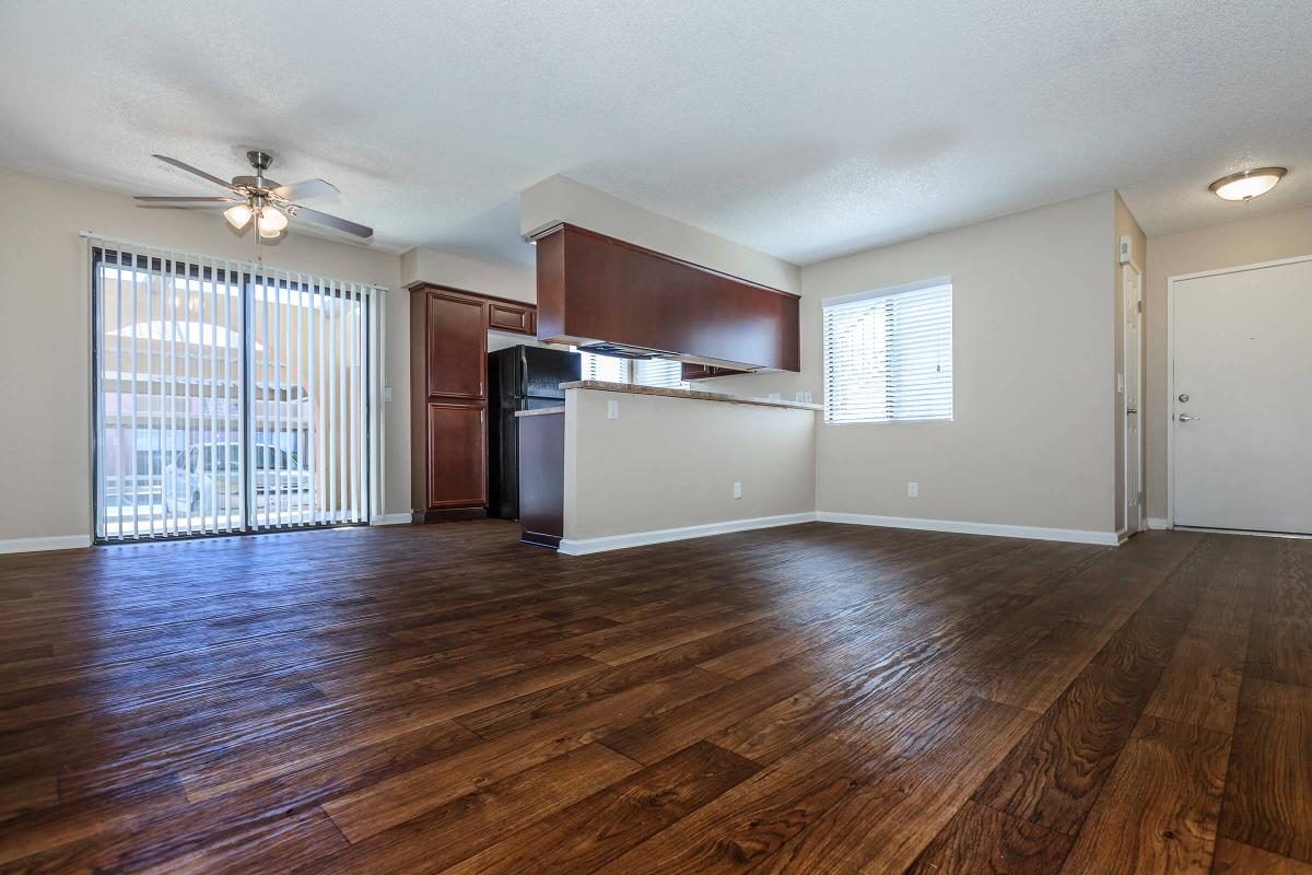 a large empty room with a wood floor