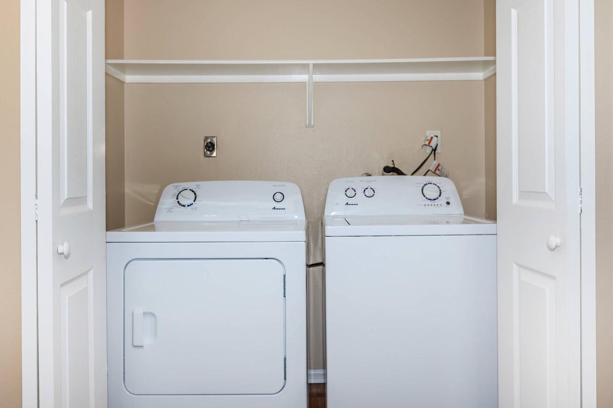 a white refrigerator freezer sitting next to a door