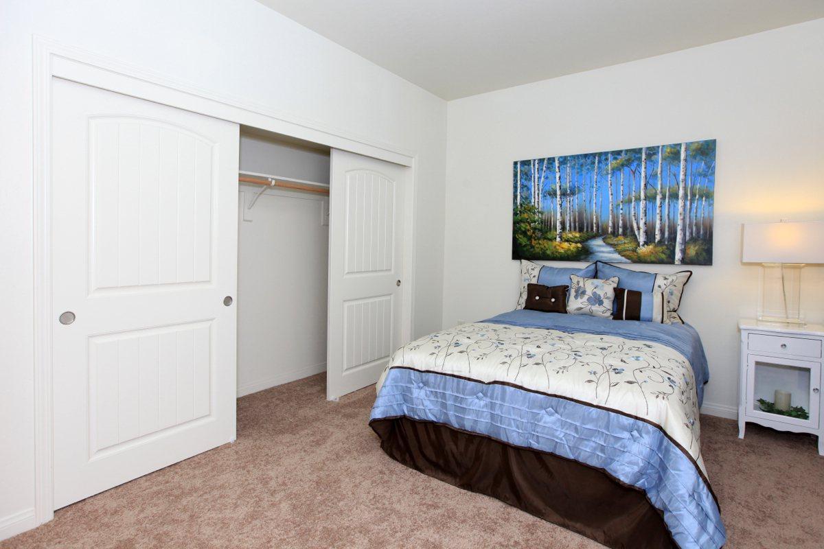 a bedroom with a bed in a room