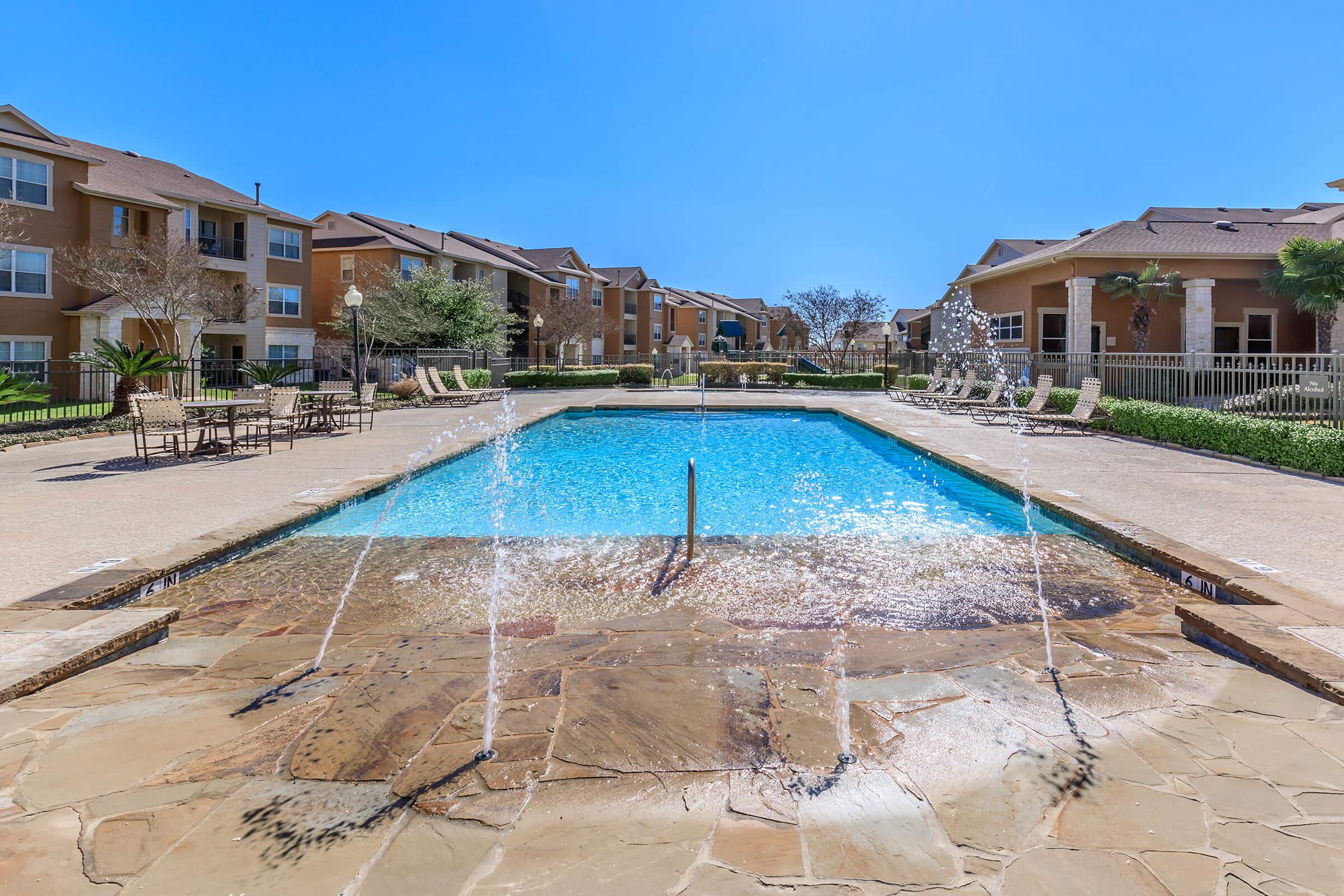 SPARKLING SWIMMING POOL AT SOUTHPARK RANCH APARTMENTS
