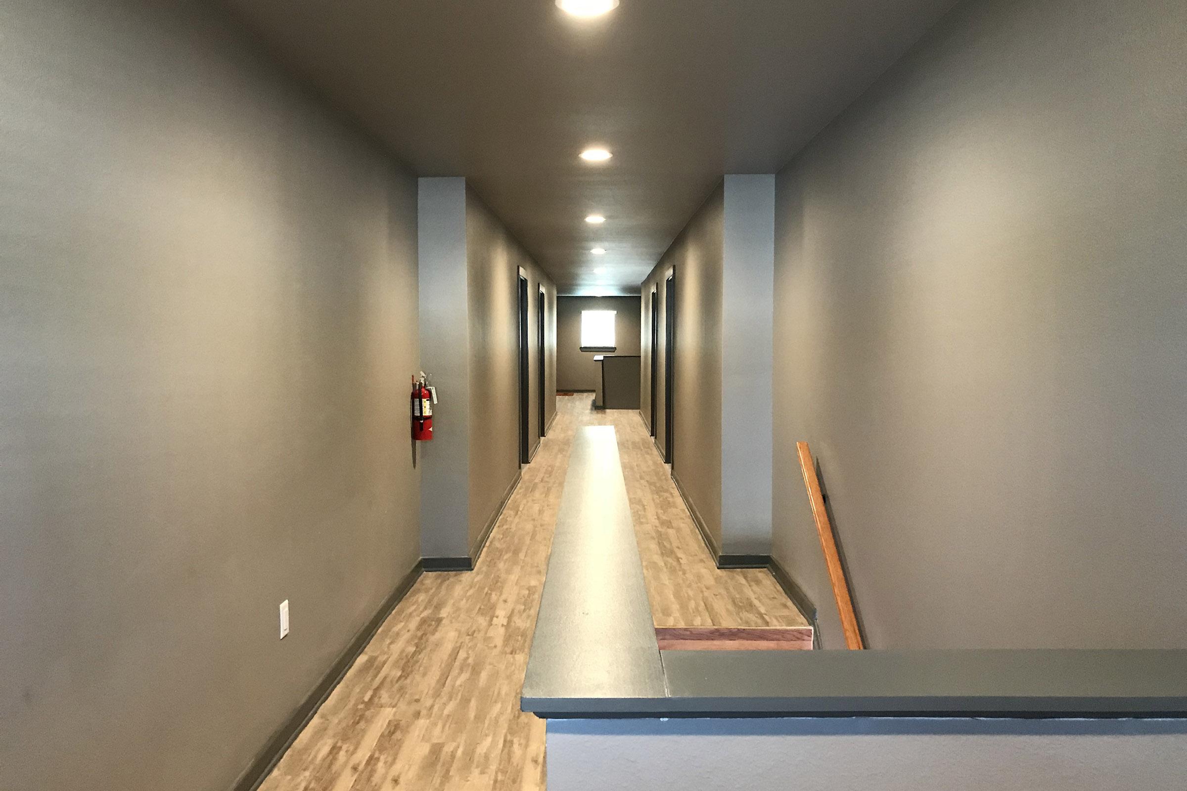 community hallway with wooden floors