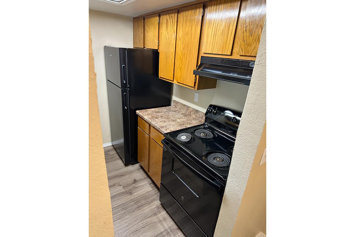 a kitchen with a stove top oven sitting inside of a refrigerator