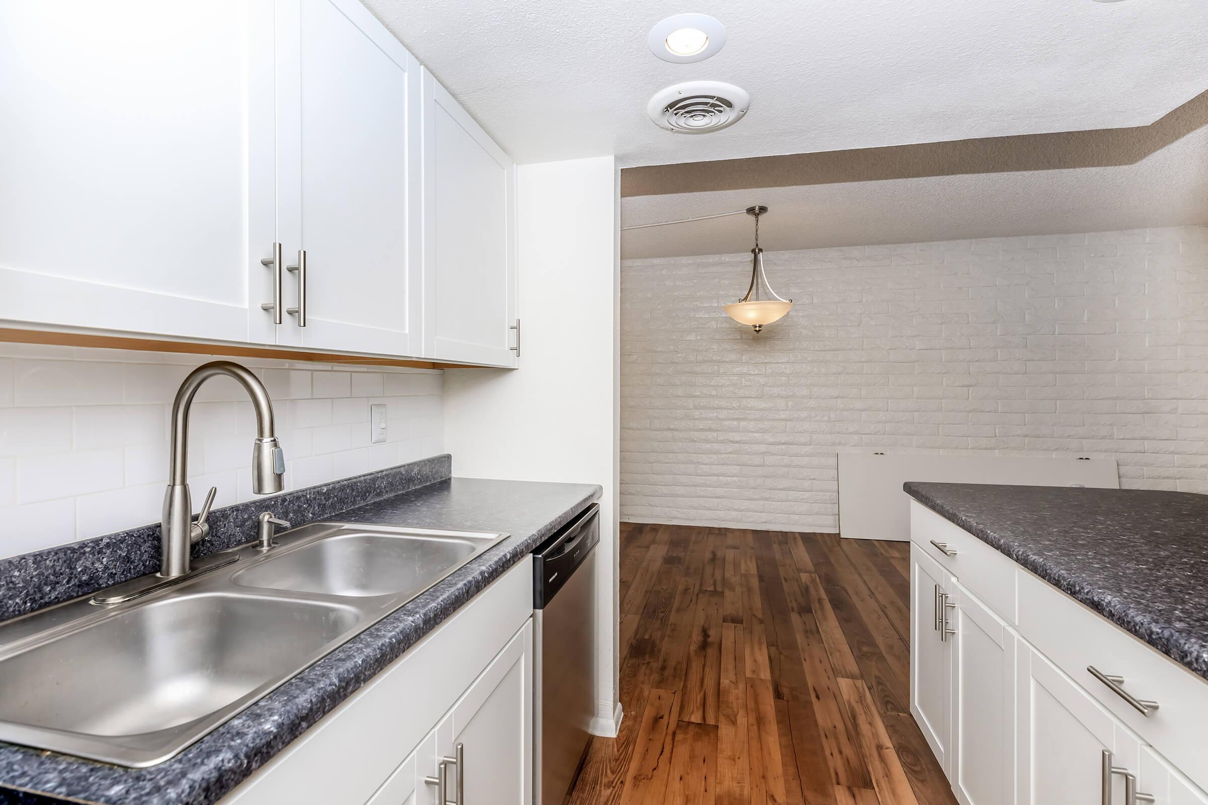 a kitchen with a stove and a sink