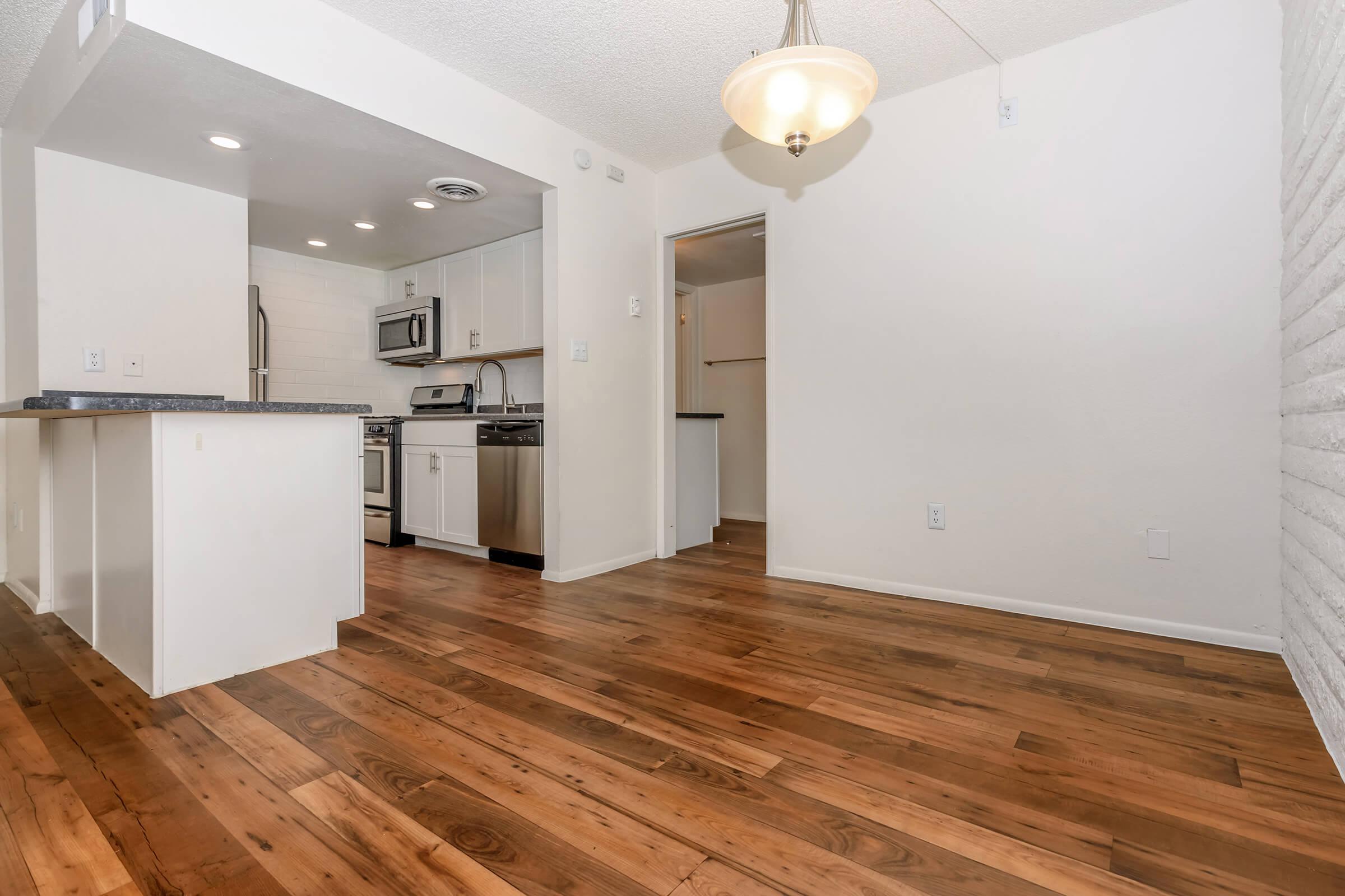 a kitchen with a wood floor