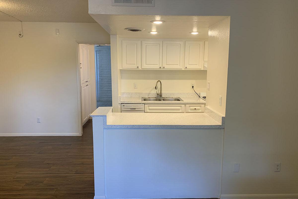 a white refrigerator freezer sitting inside of a kitchen