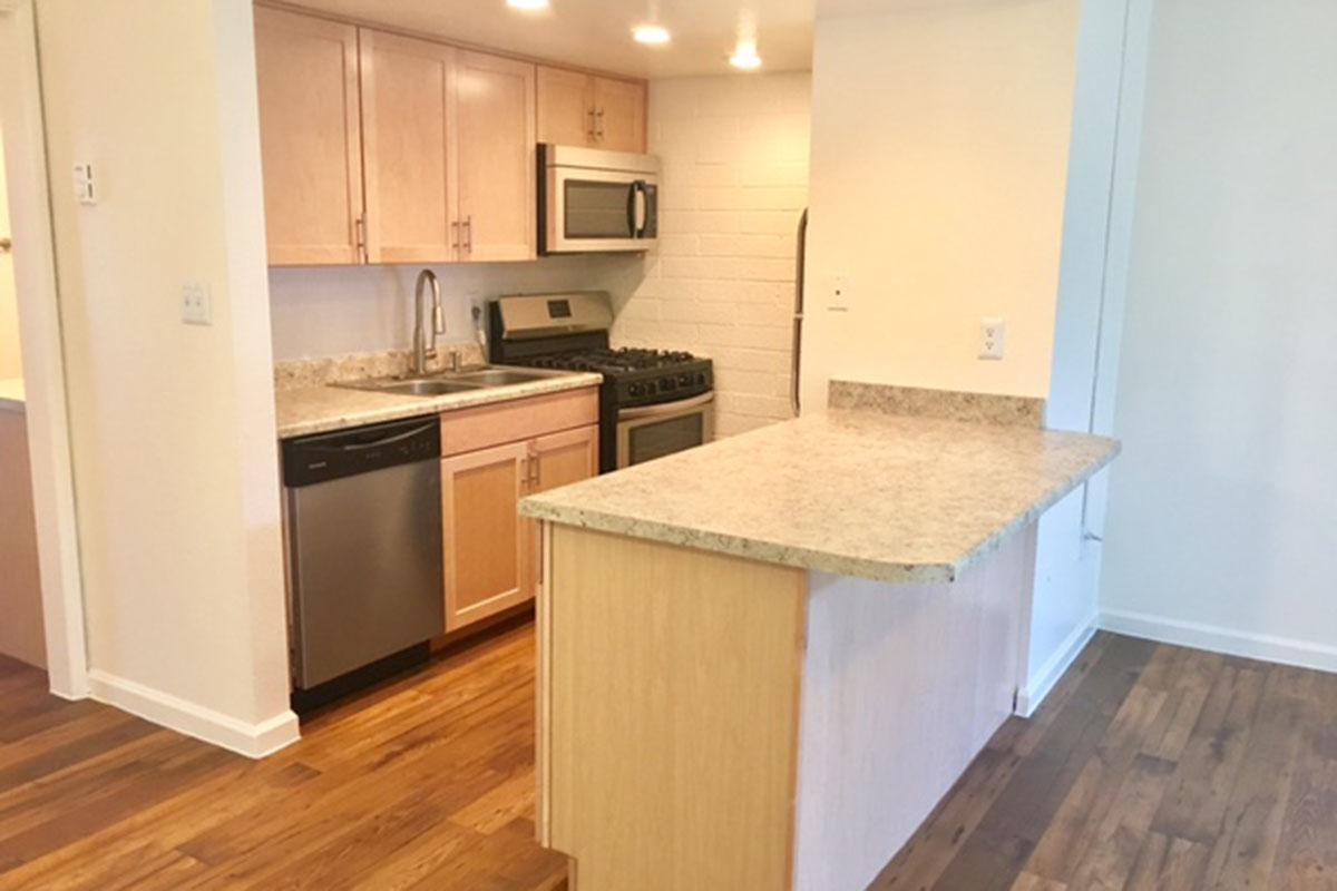 a kitchen with a wood floor