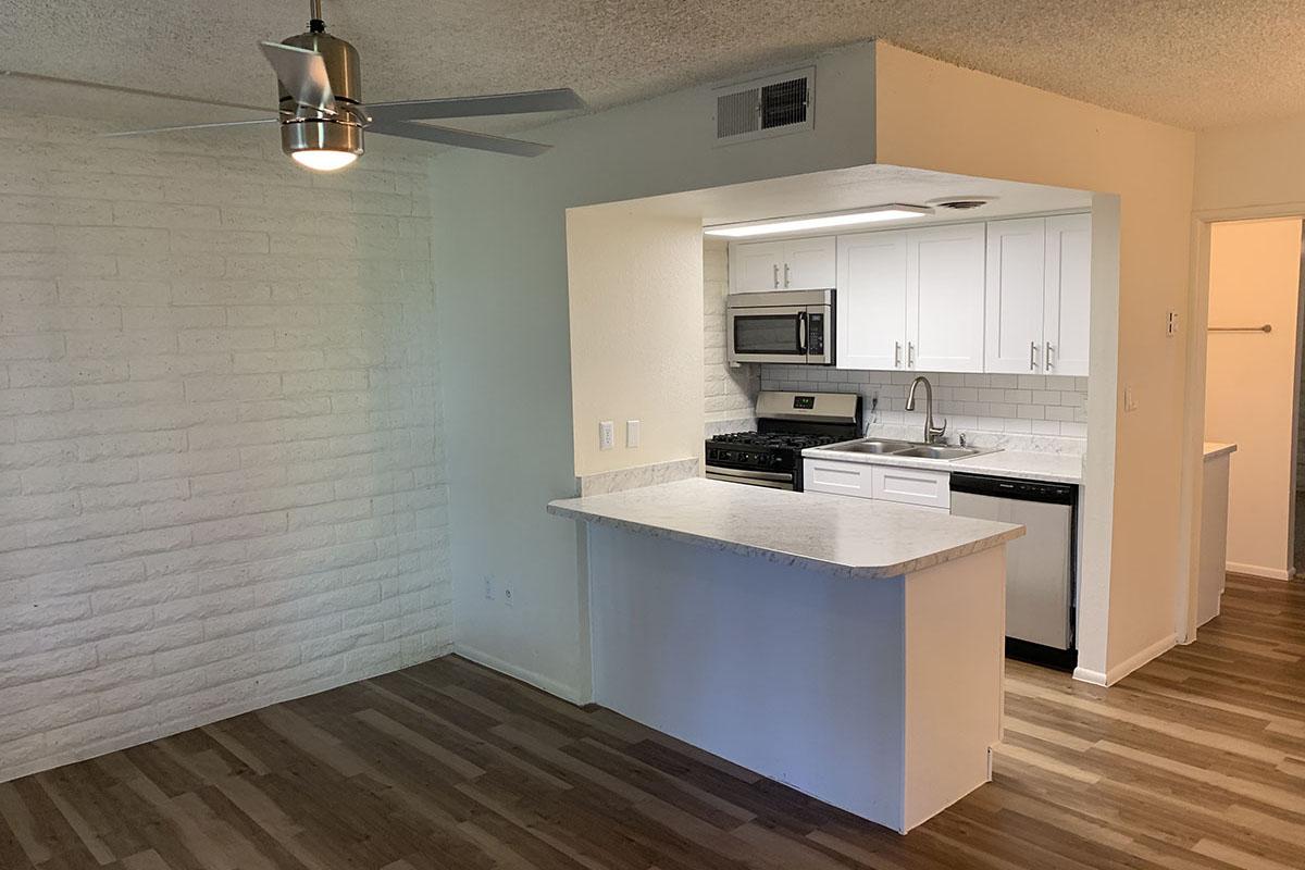 a kitchen with a wood floor