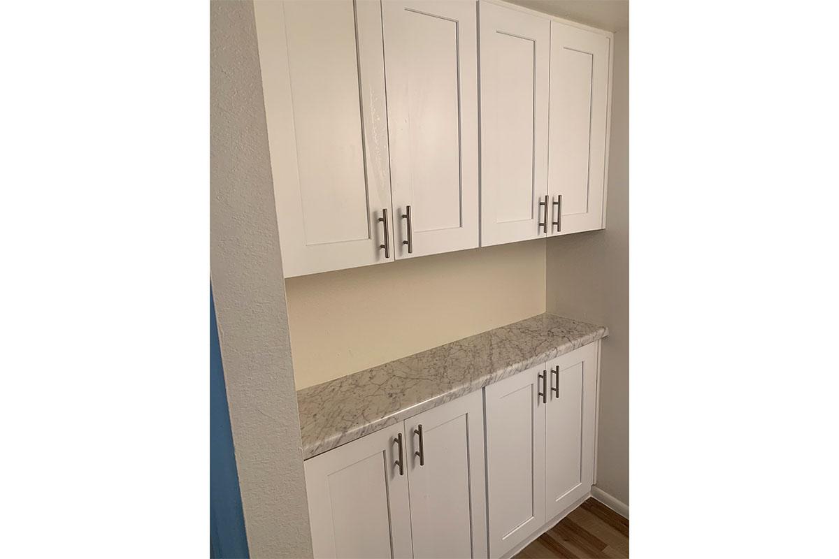 a white refrigerator freezer sitting inside of a kitchen