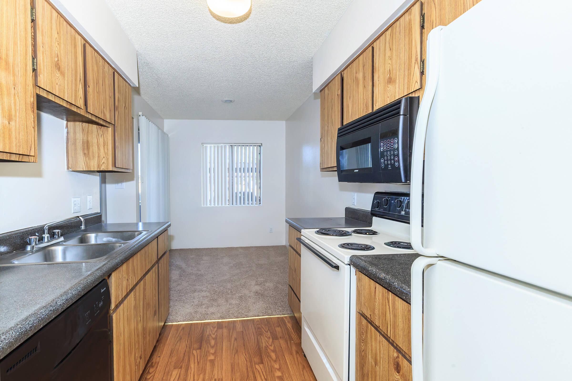 a kitchen with a stove and a refrigerator