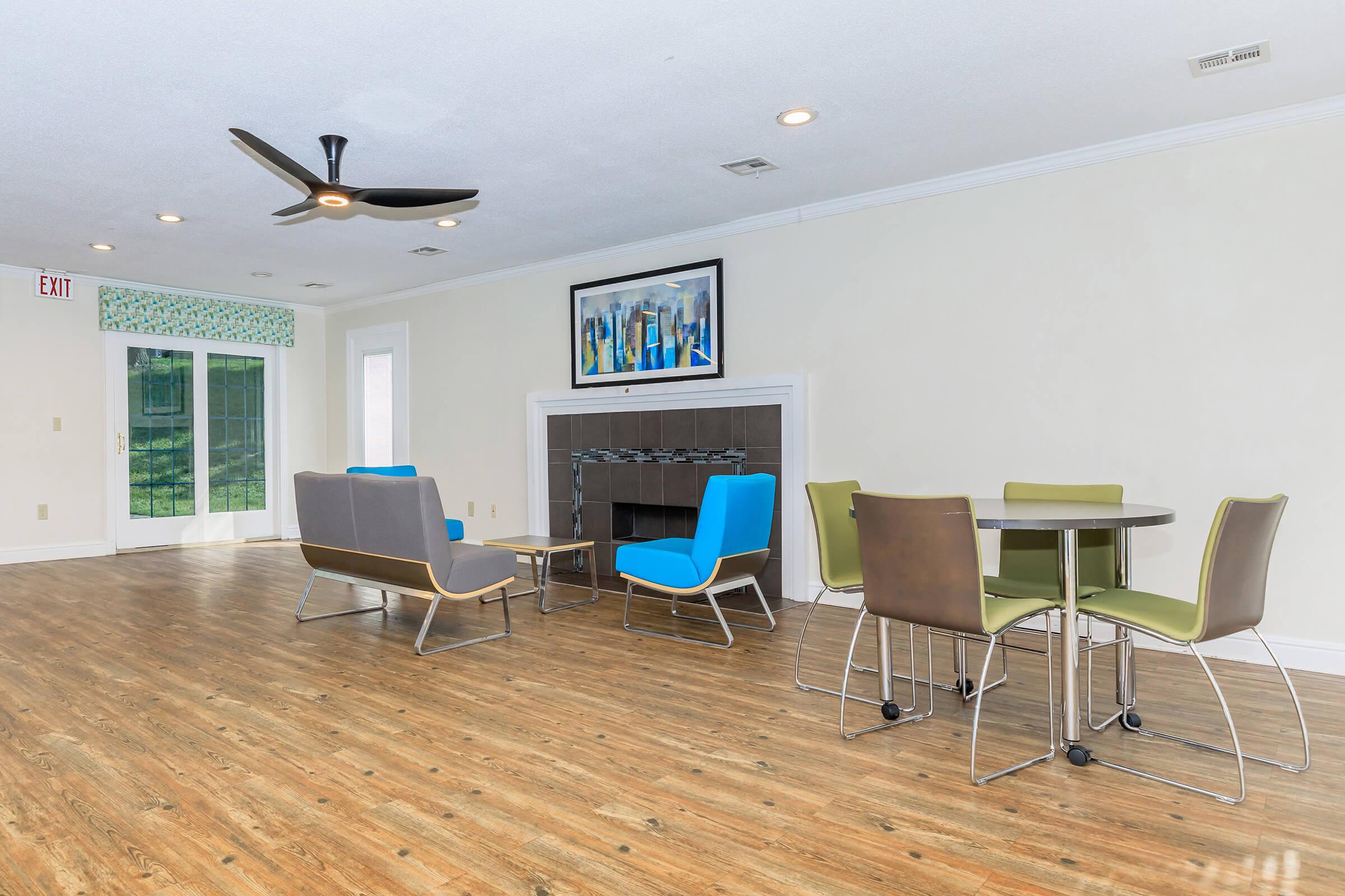 a living room filled with furniture and a tv