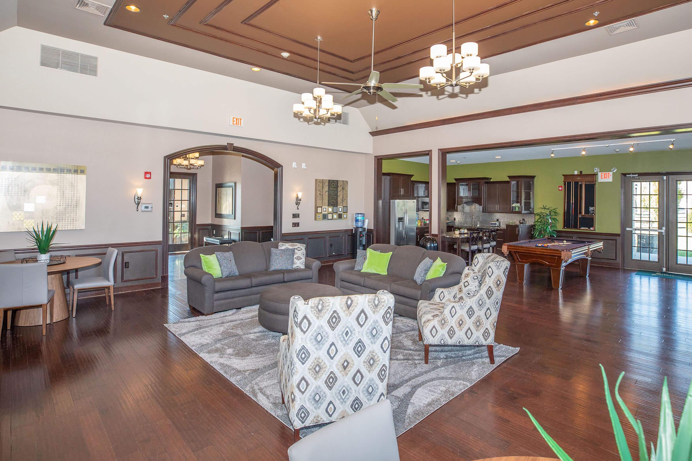 a living room filled with furniture and a large window