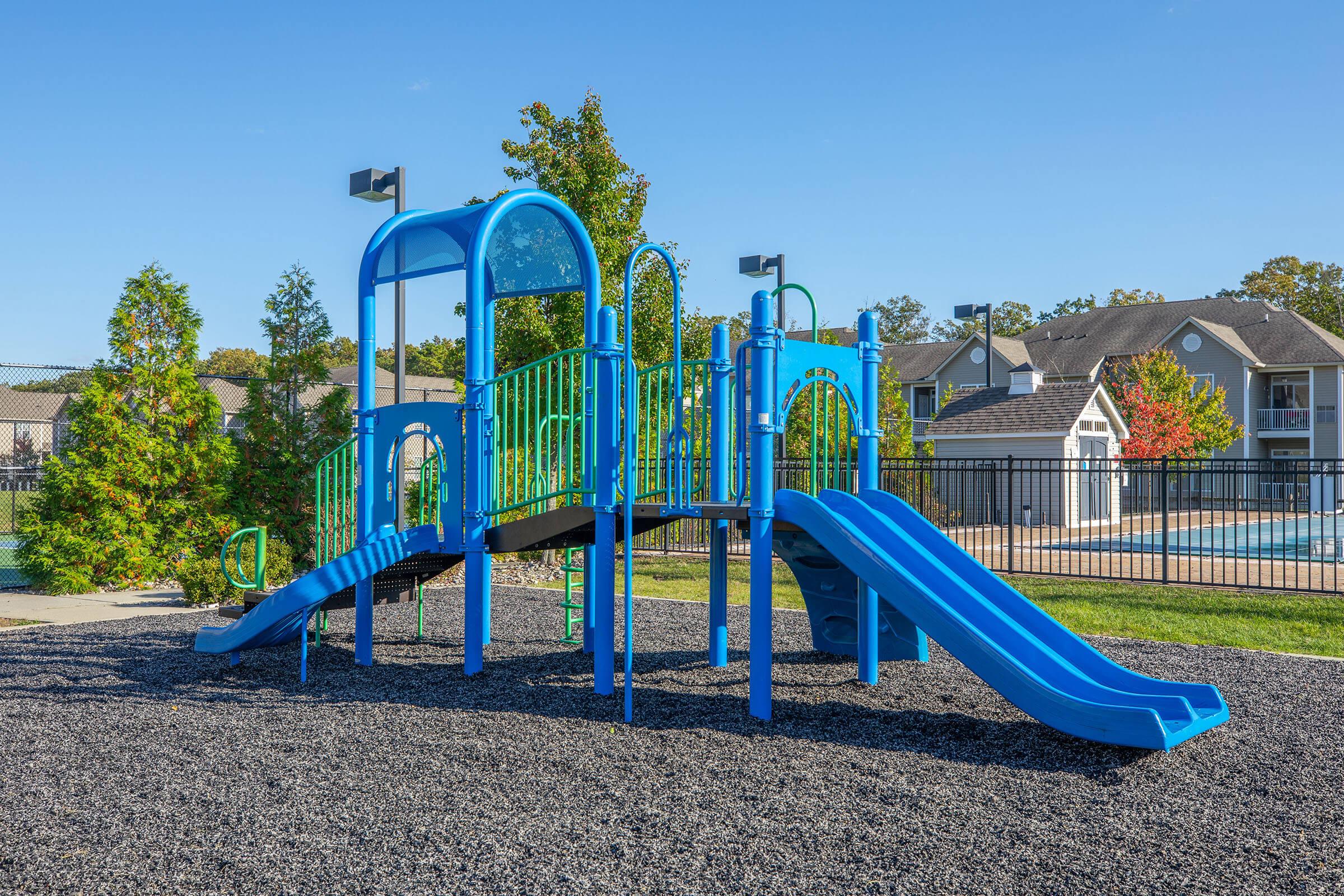 a playground with a blue chair