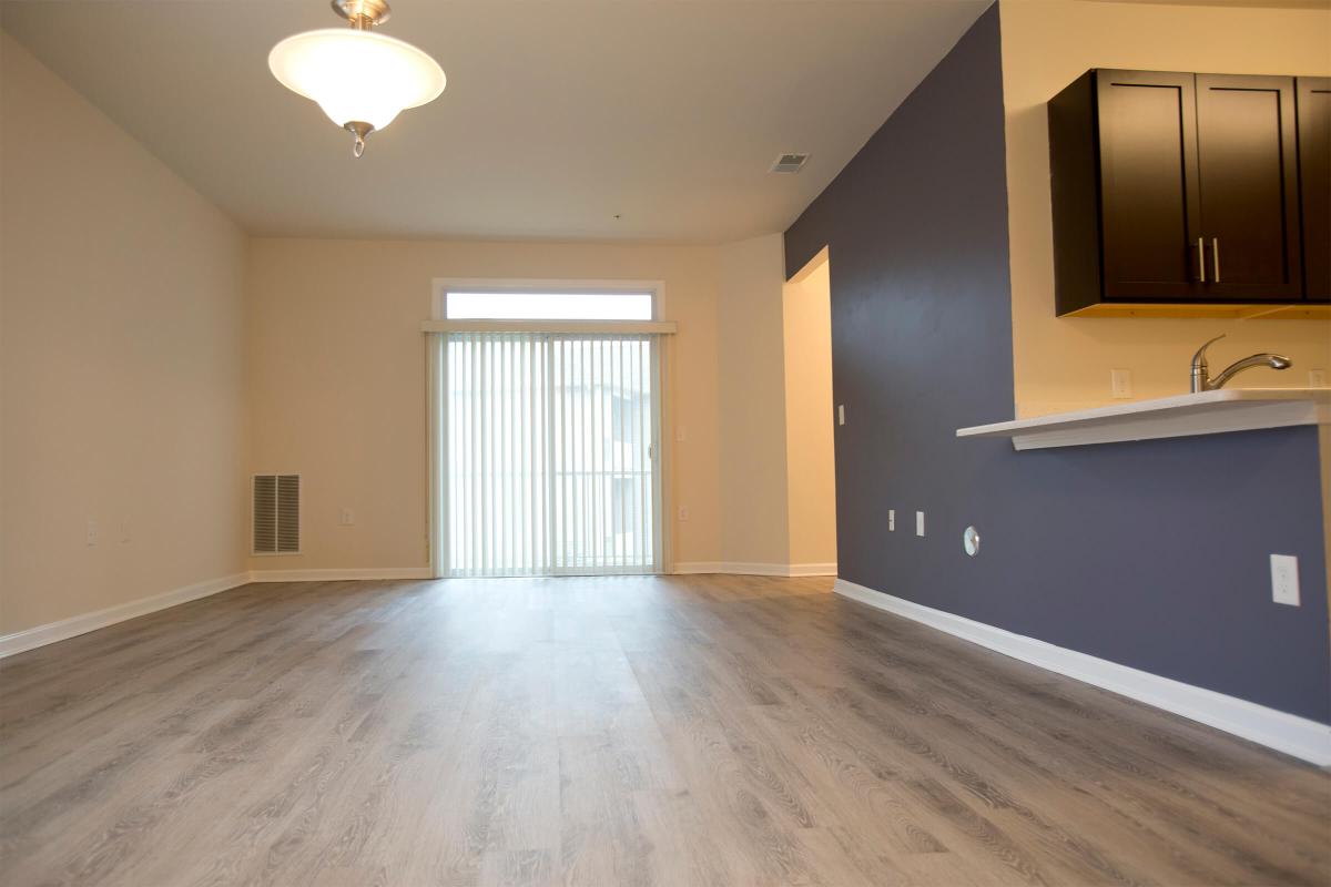 a large empty room with a wood floor