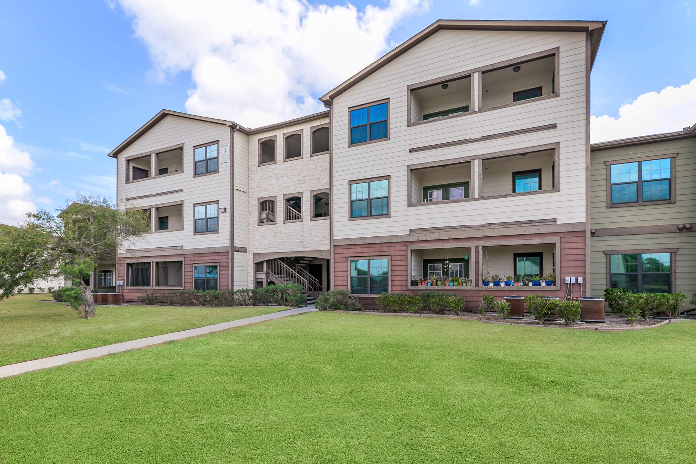 a large lawn in front of a building