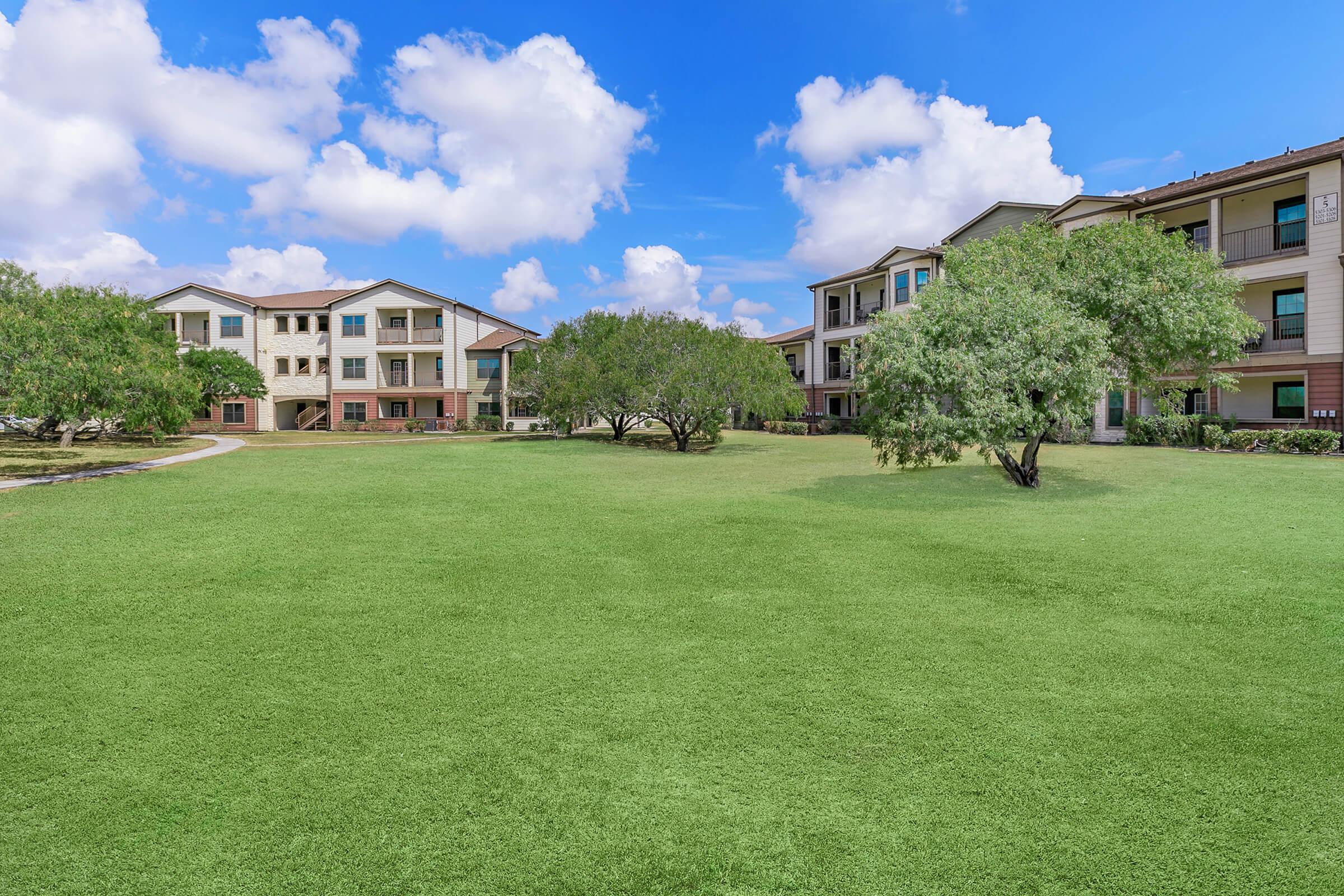 a building with a grassy field