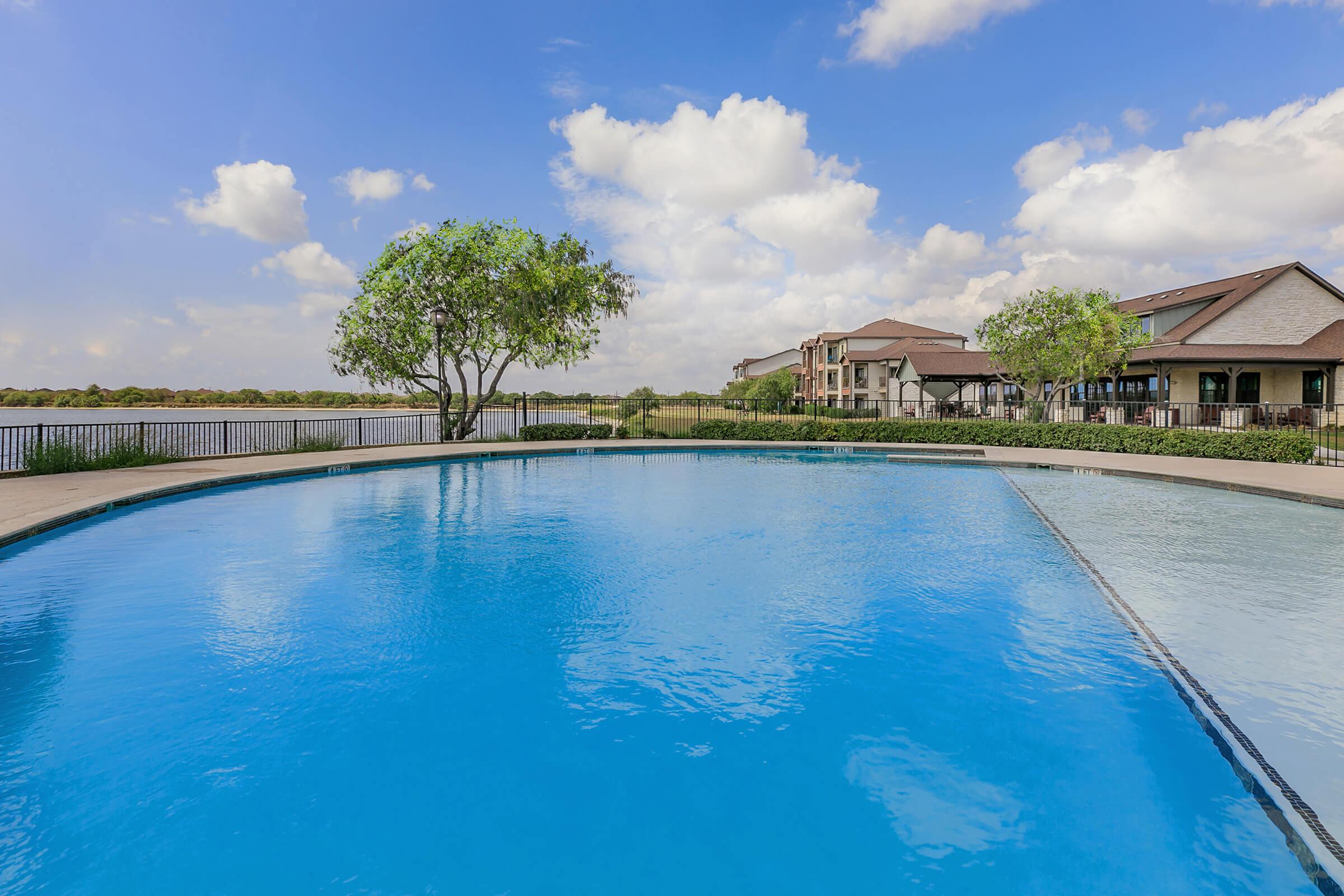 a pool next to a body of water