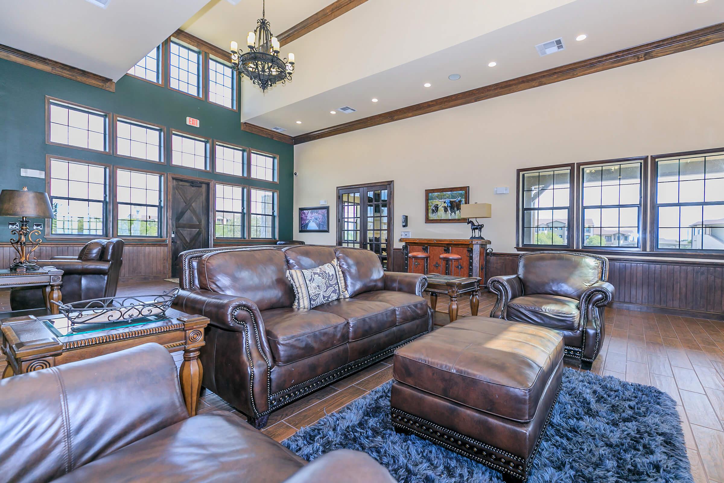 a living room filled with furniture and a large window