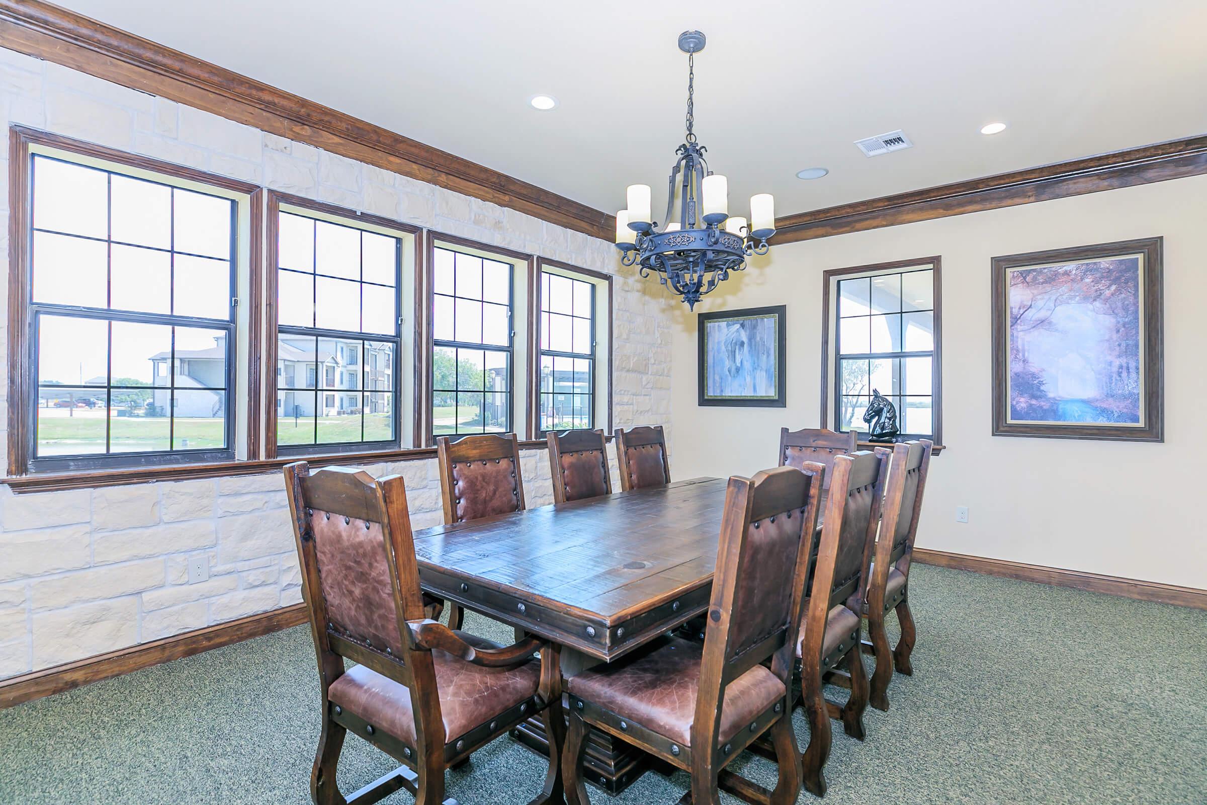 a living room filled with furniture and a large window