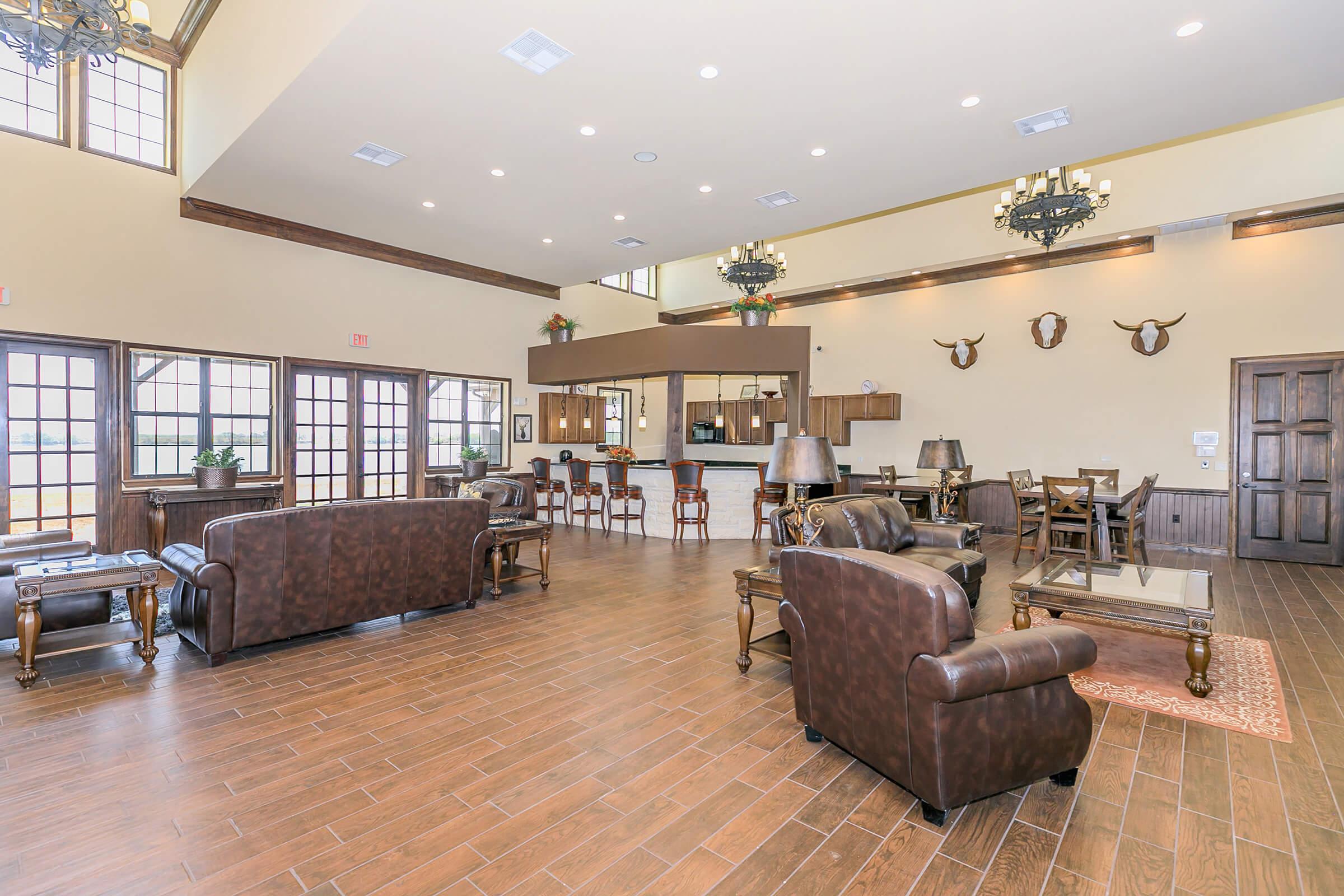 a living room filled with furniture and a flat screen tv