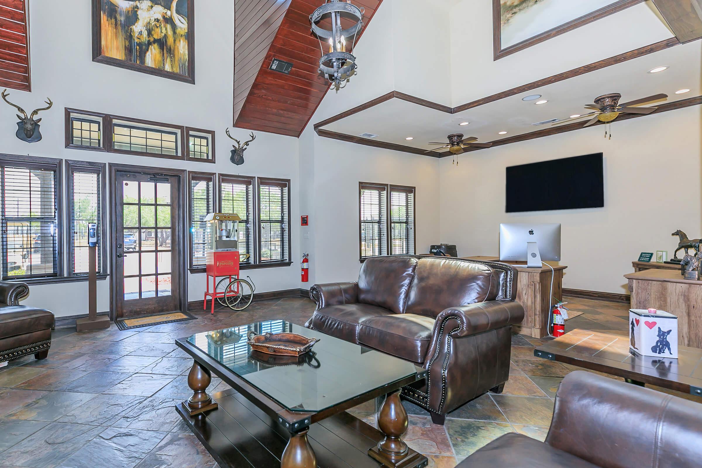 a living room filled with furniture and a fire place