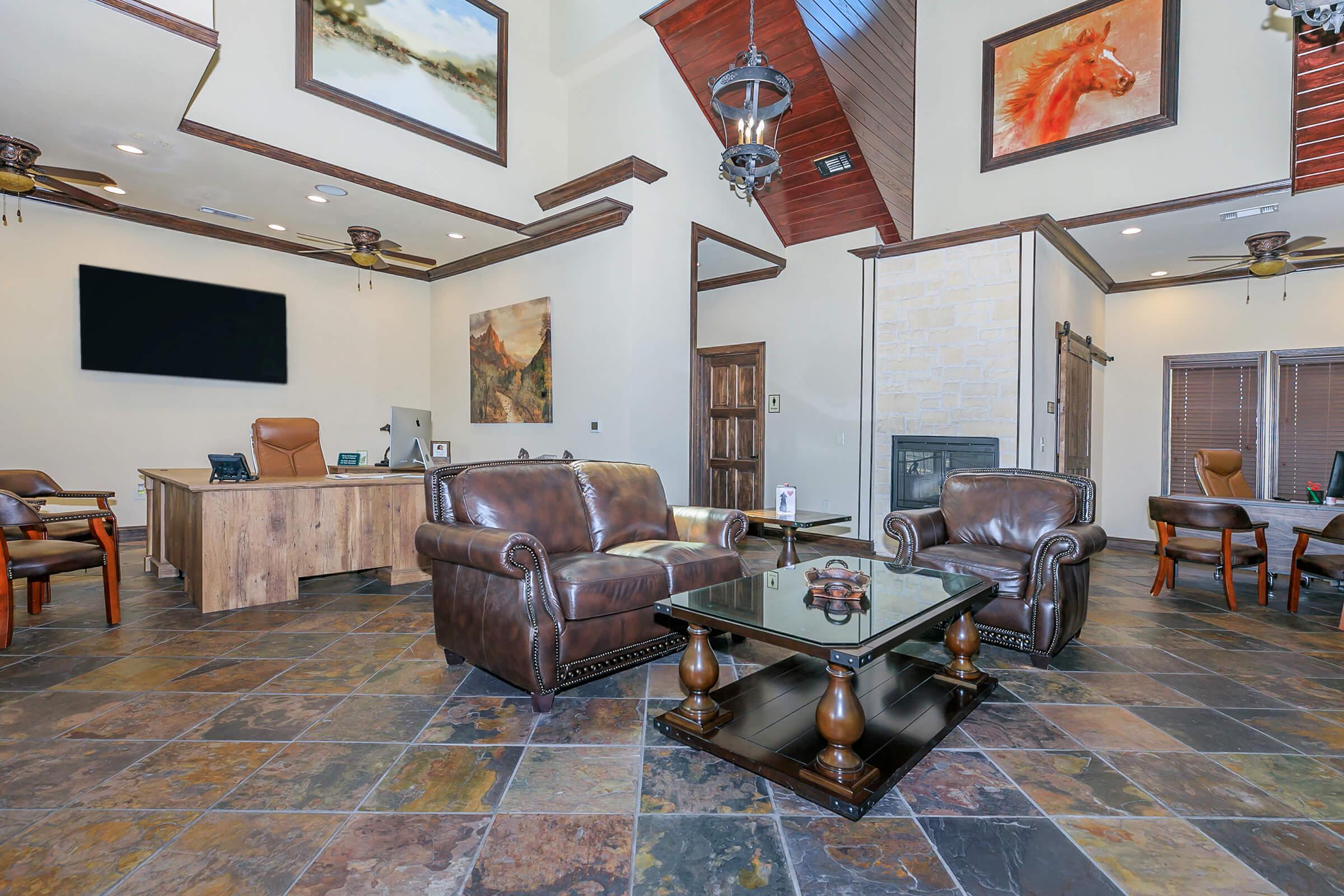 a living room filled with furniture and a fire place