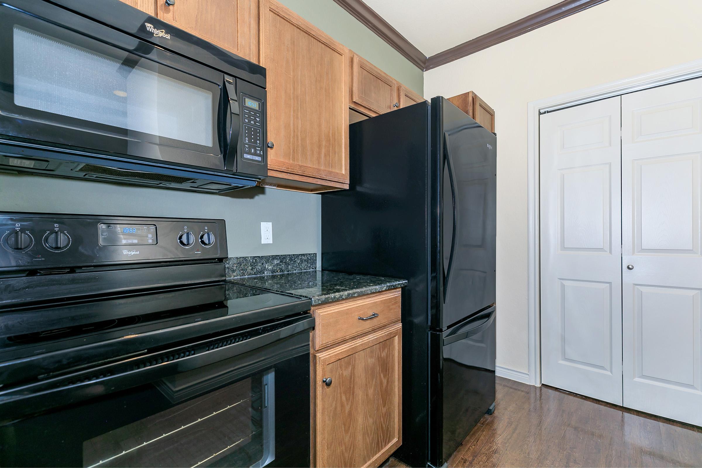 a stove top oven sitting inside of a kitchen