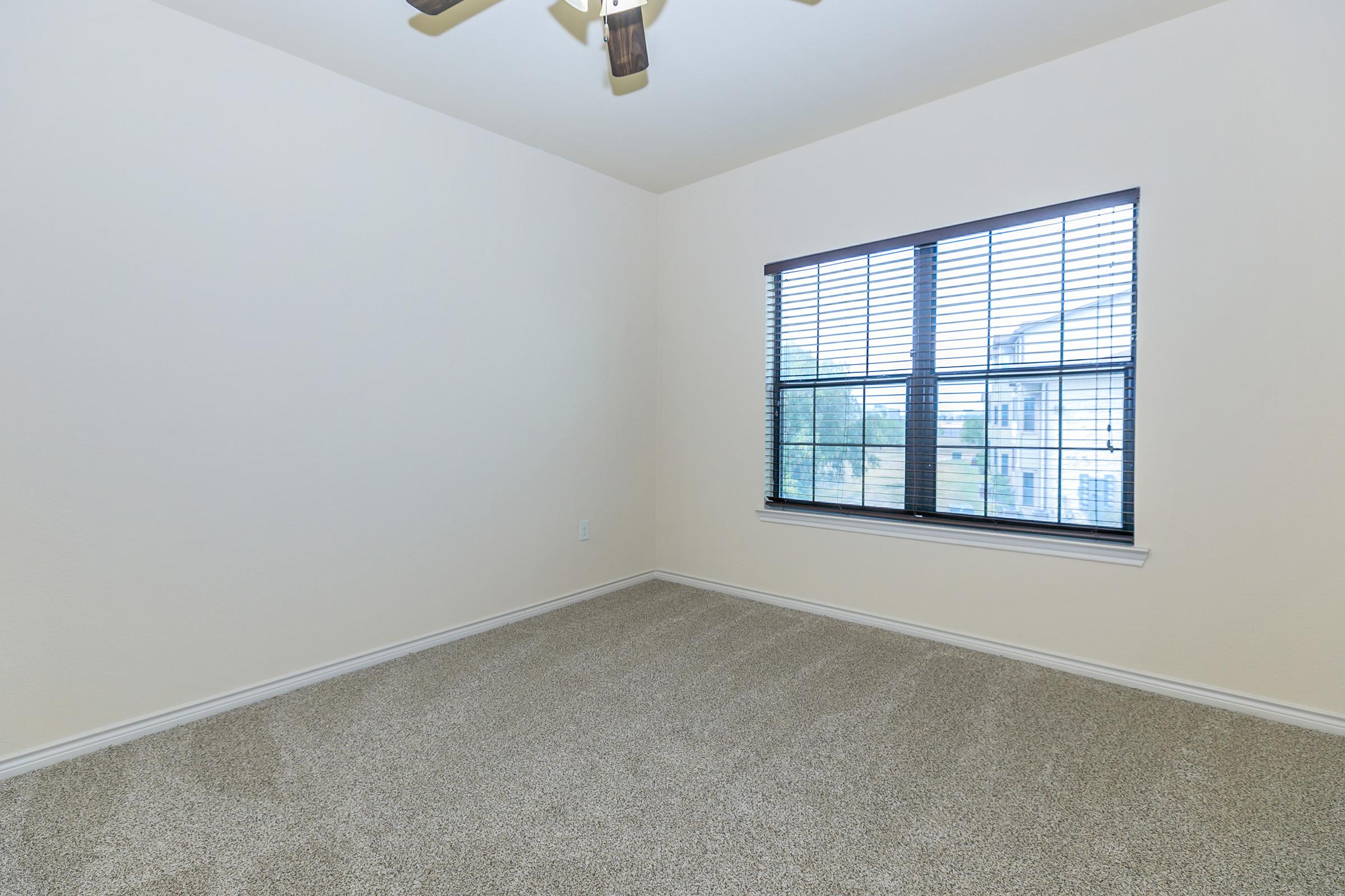 a view of a bedroom next to a window