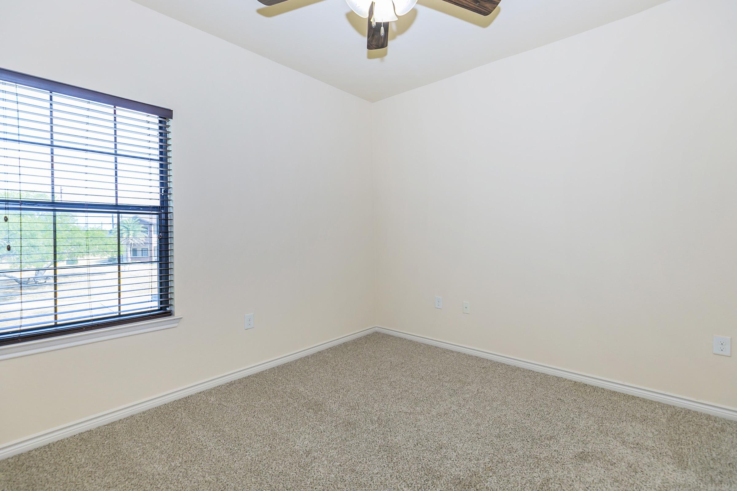 a bedroom with a large window