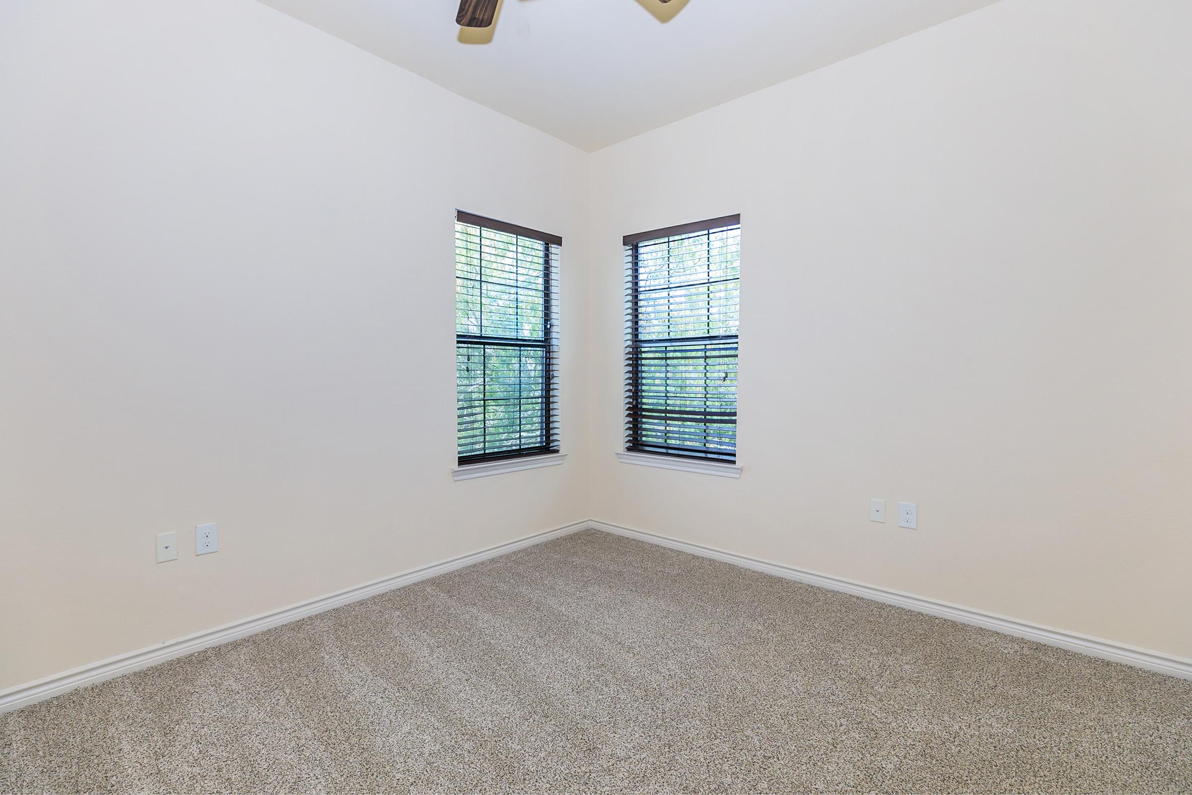 a bedroom with a large window