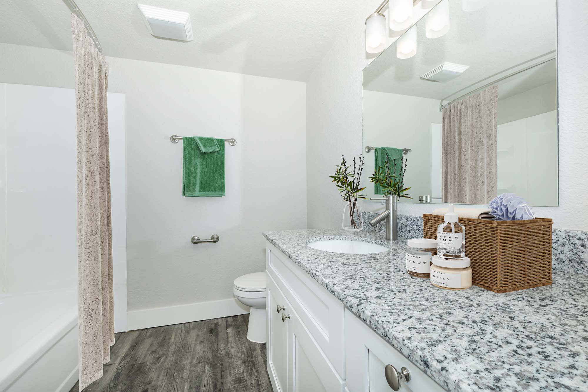 a room with a sink and a mirror