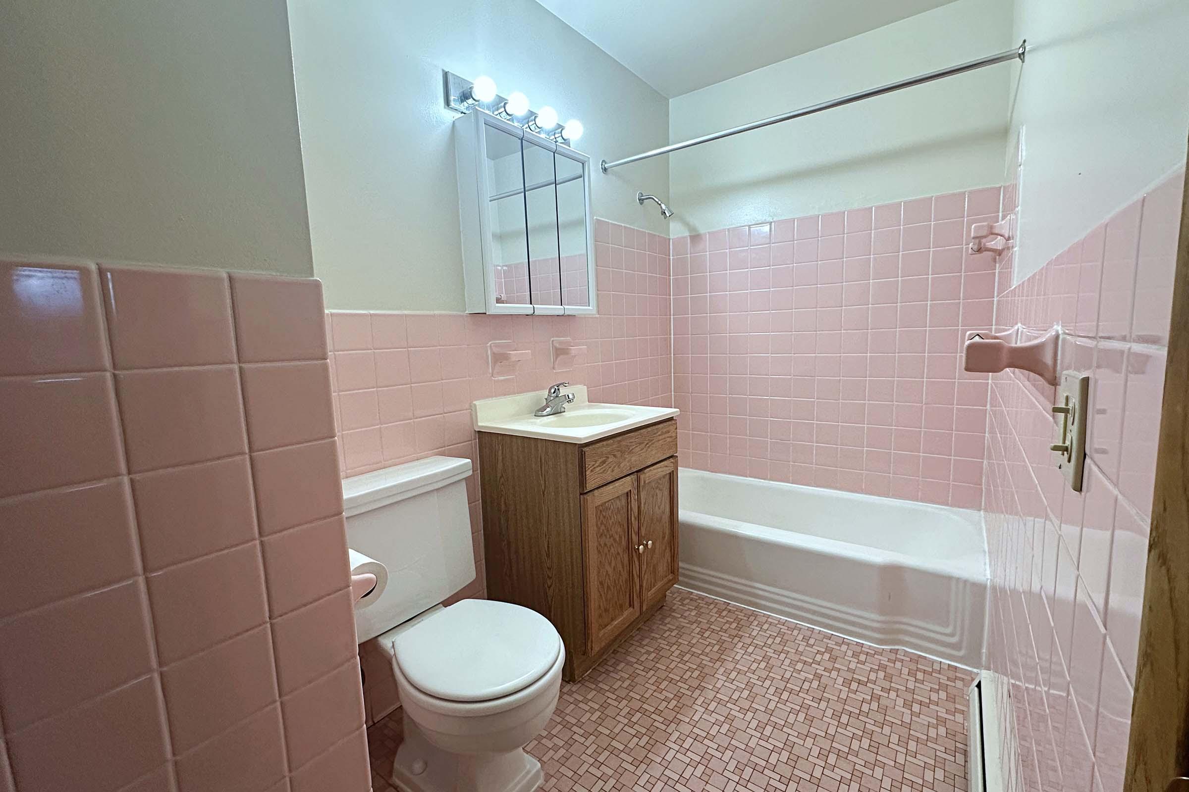 a restroom with a sink and a mirror