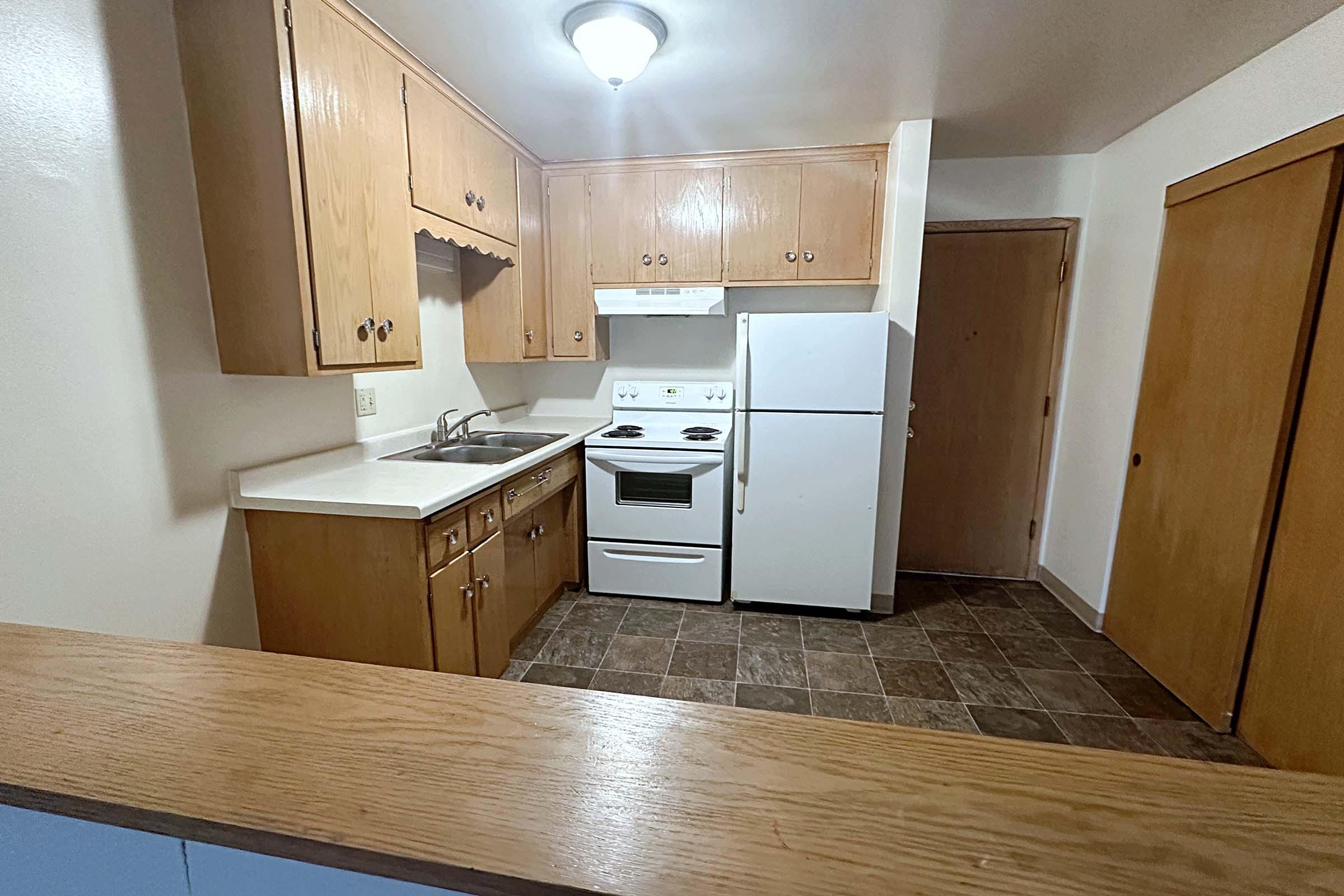 a kitchen with a wooden floor