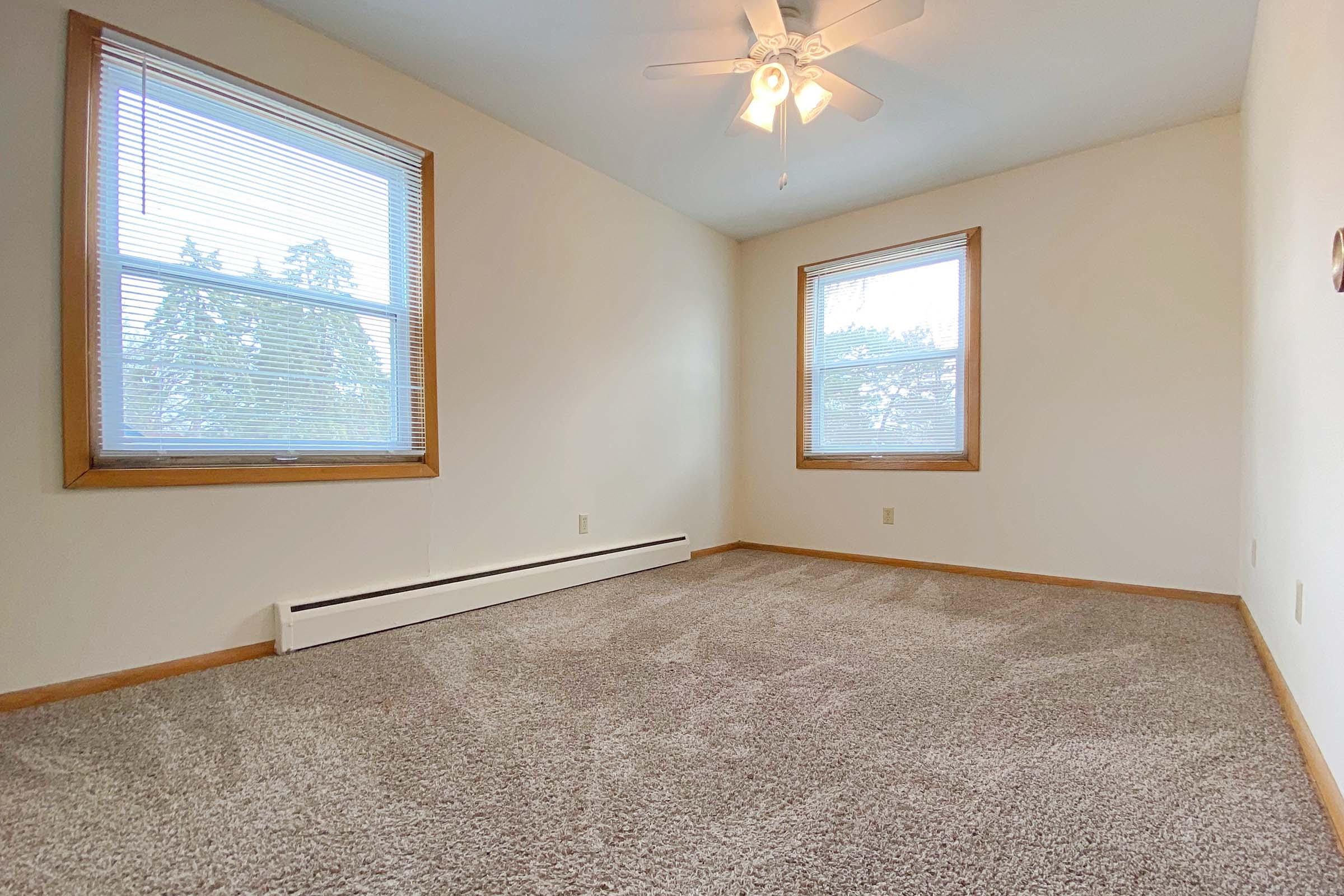 a bedroom with a large window