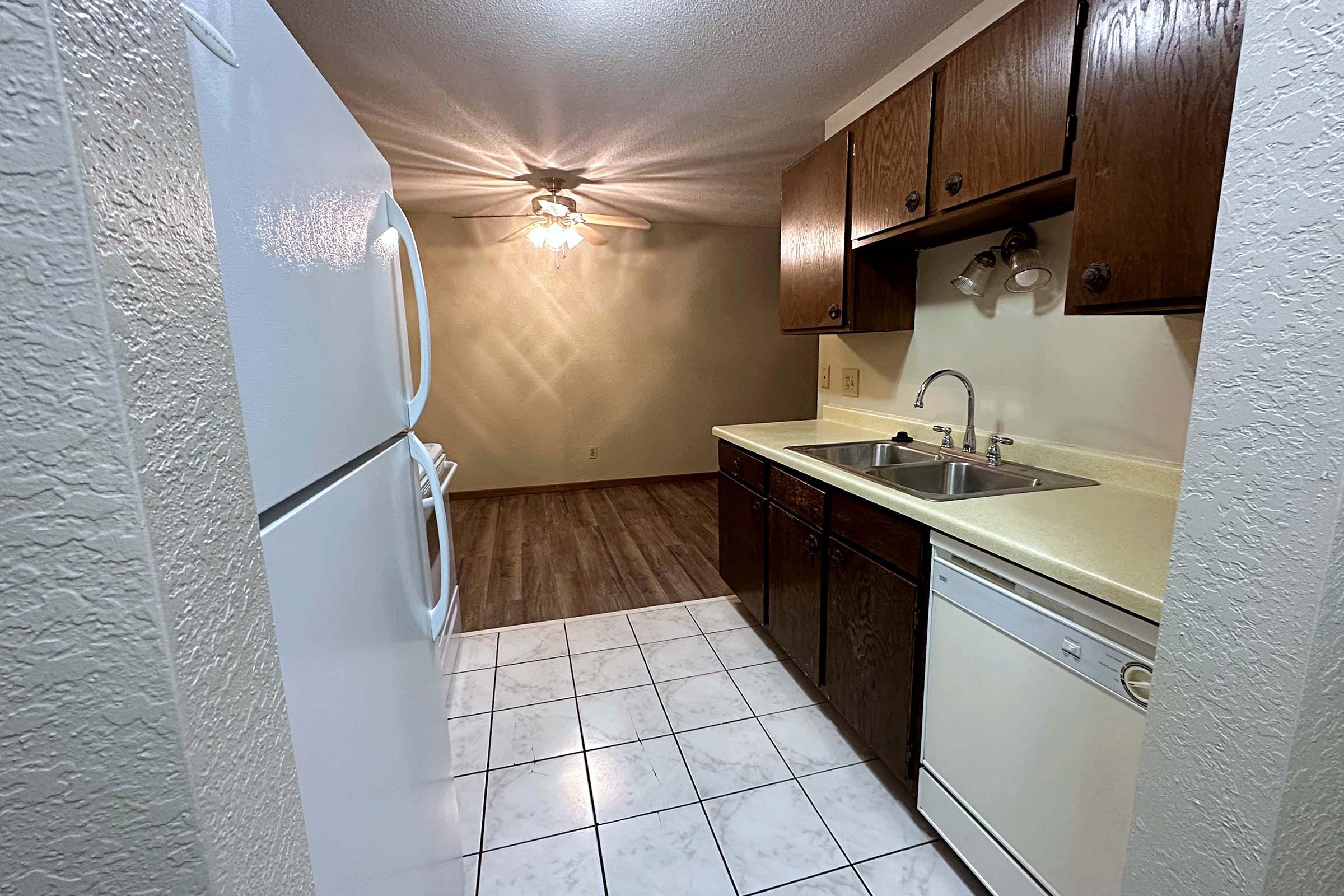 a kitchen with a tile floor