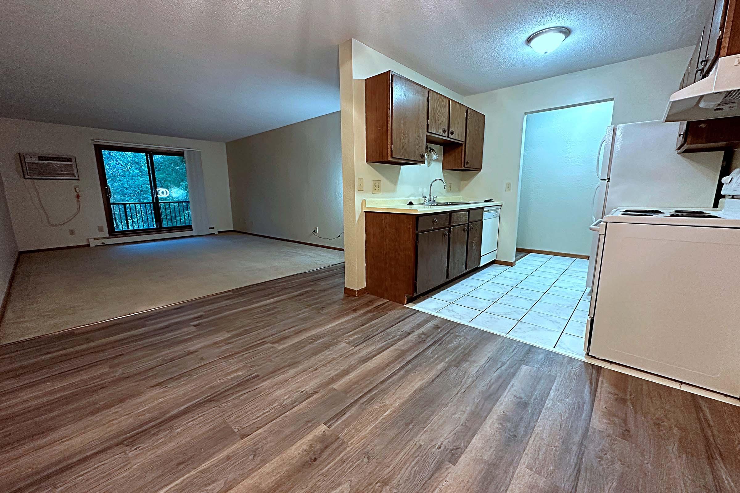 a large empty room with a wooden floor