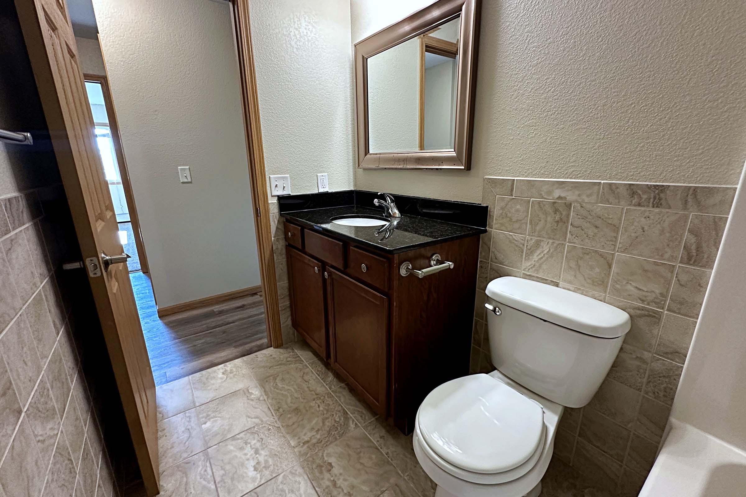 a restroom with a sink and a mirror