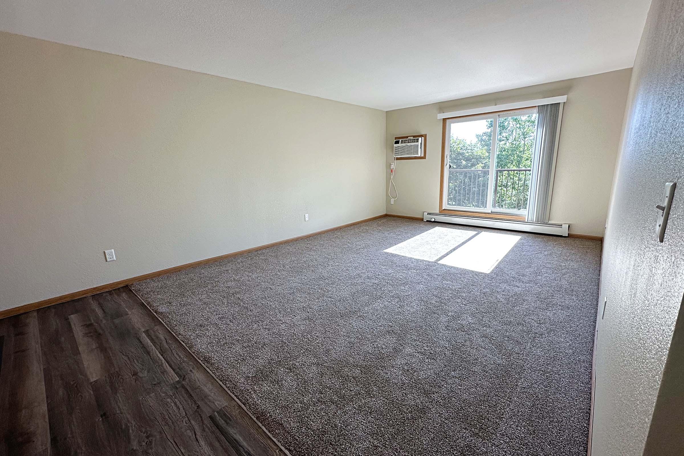 a bedroom with a large window