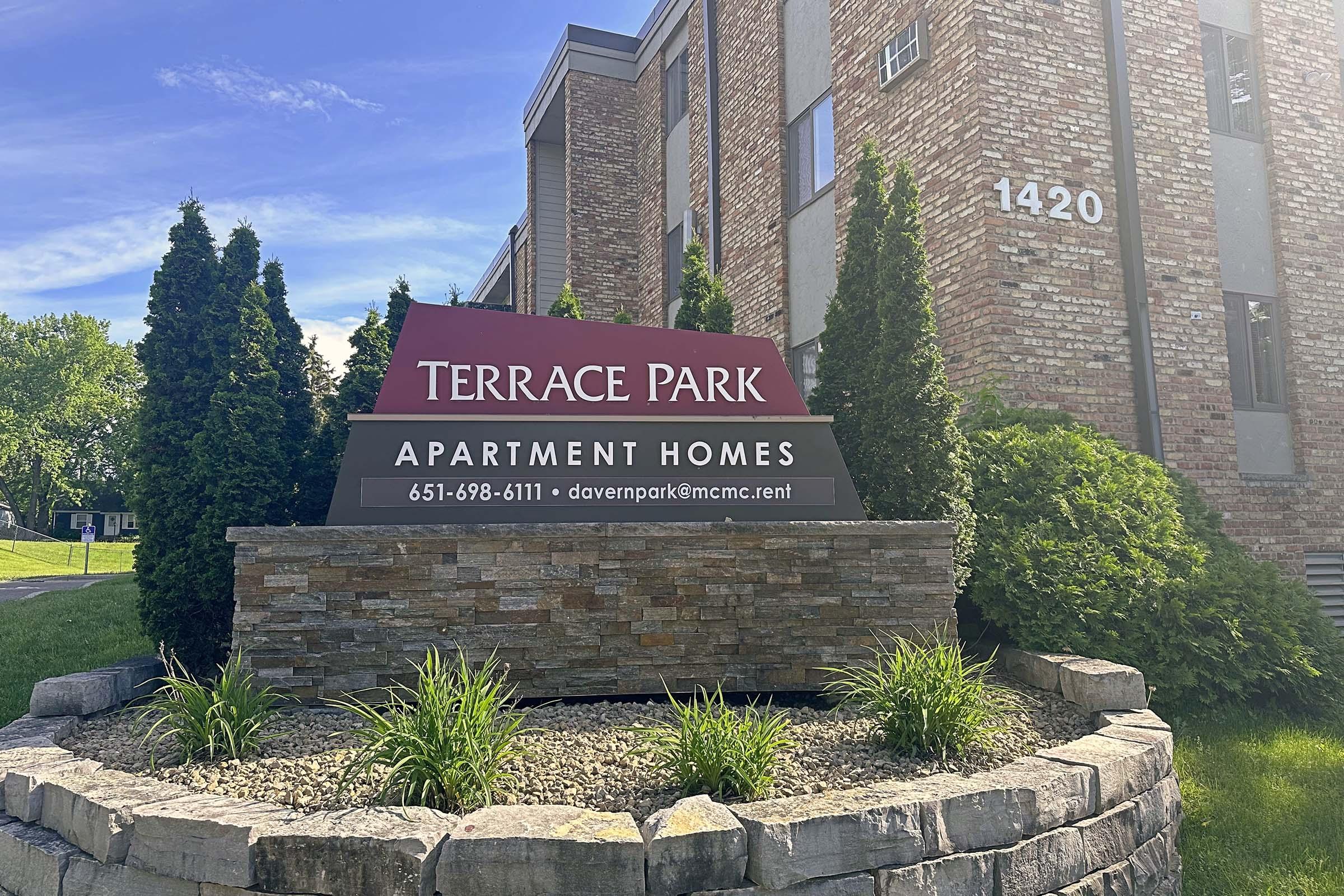 a sign on the side of a stone building