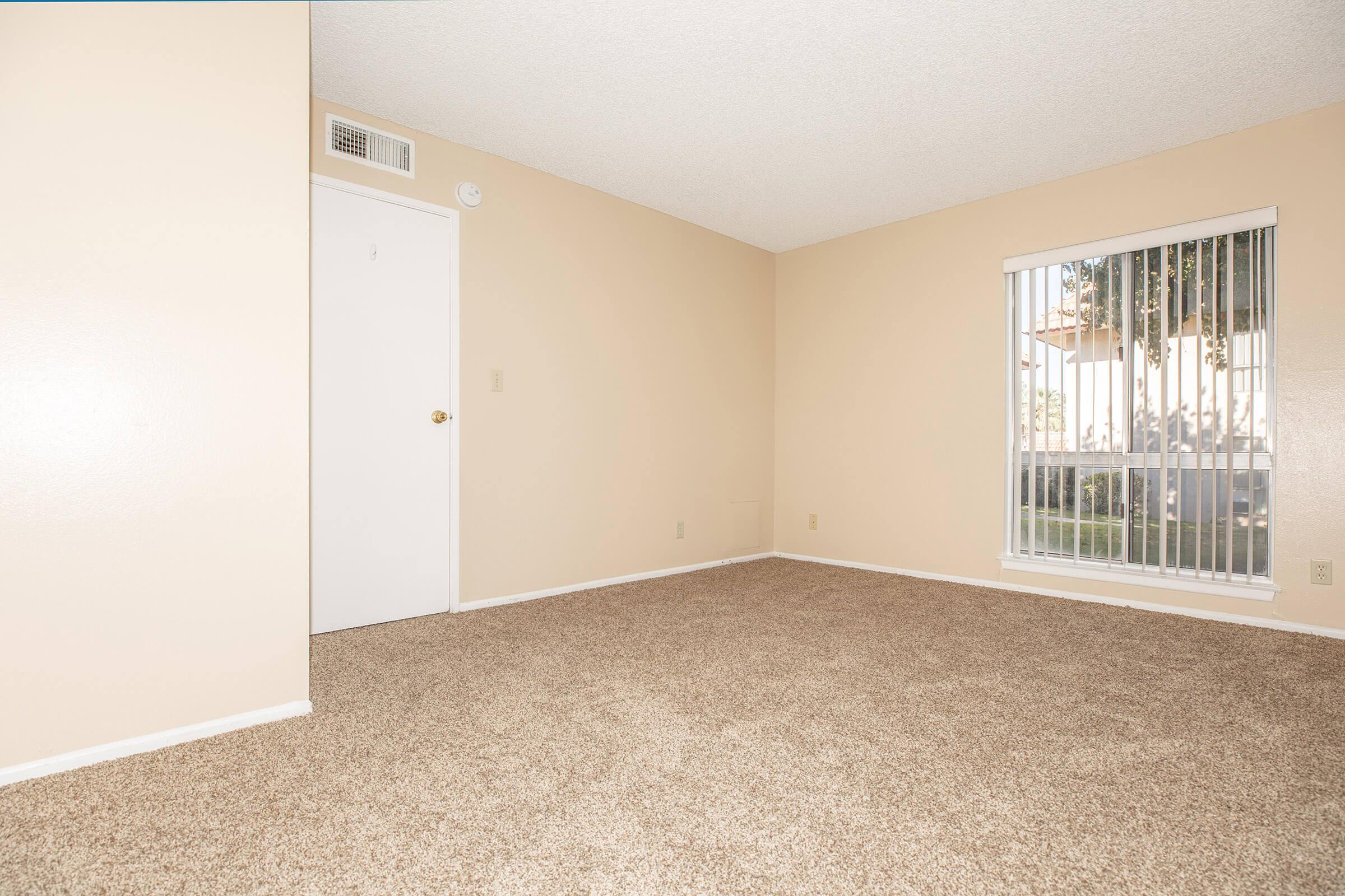 Vacant bedroom with open window blinds