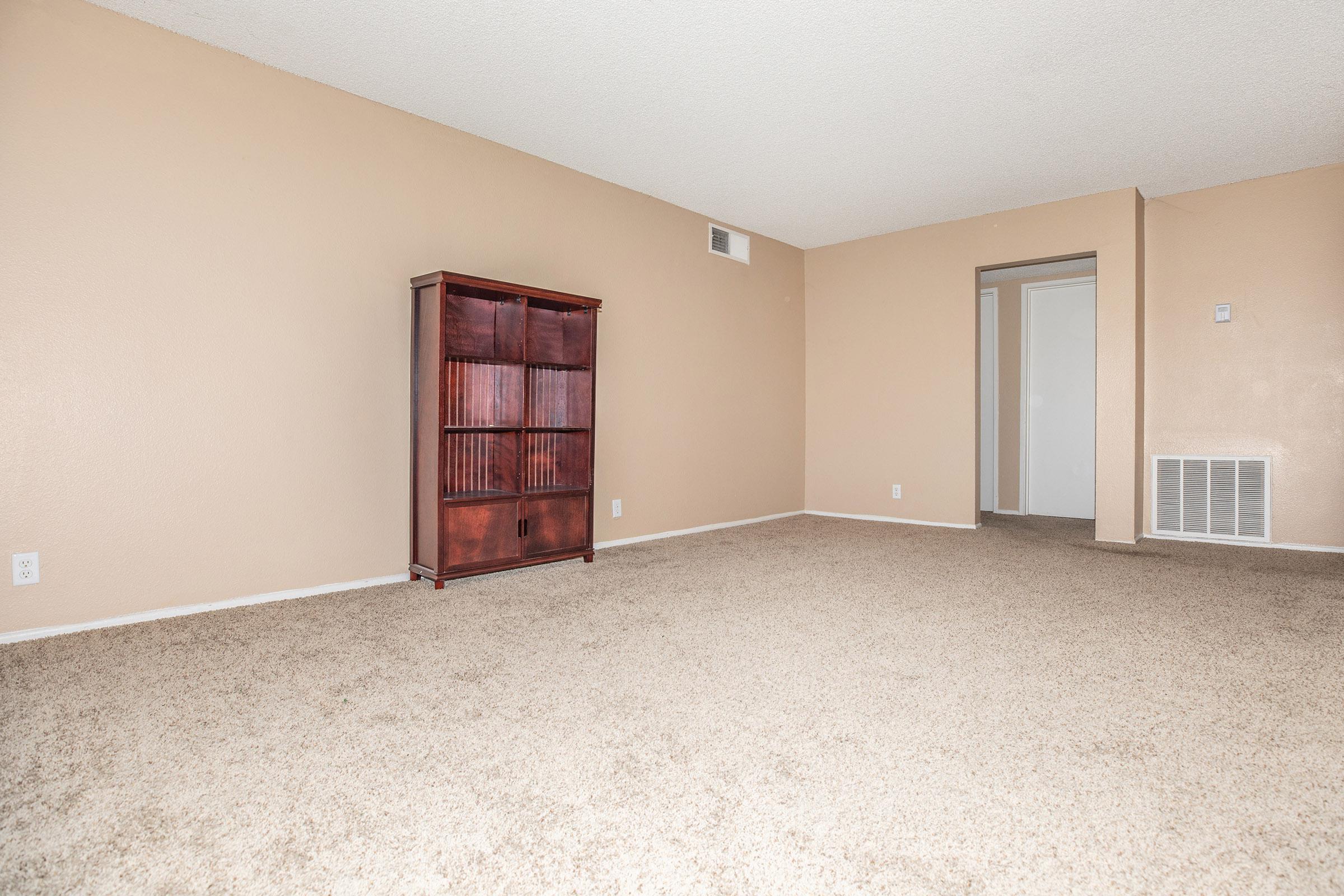 Unfurnished living room with carpets