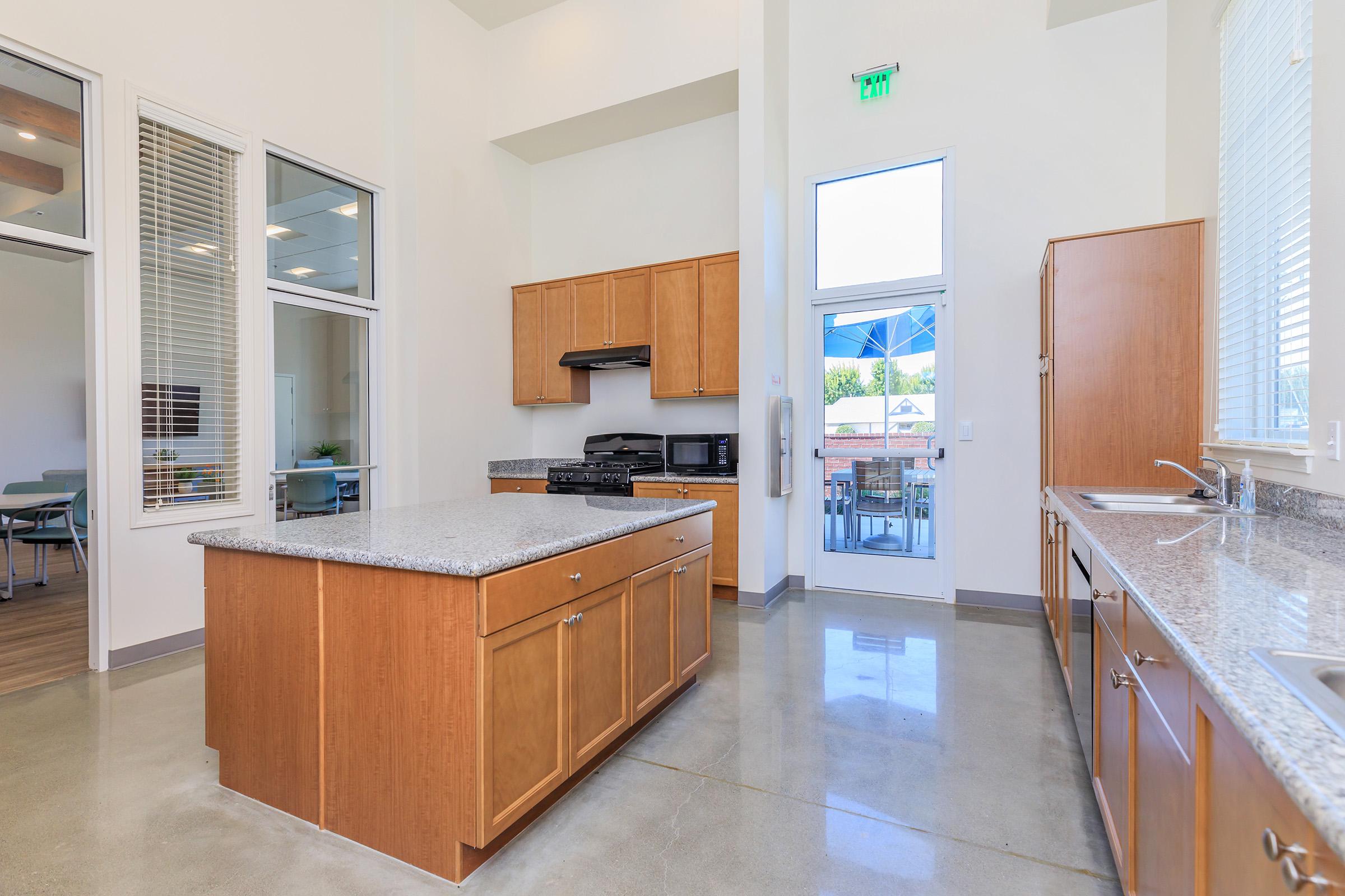 a kitchen with a sink and a window