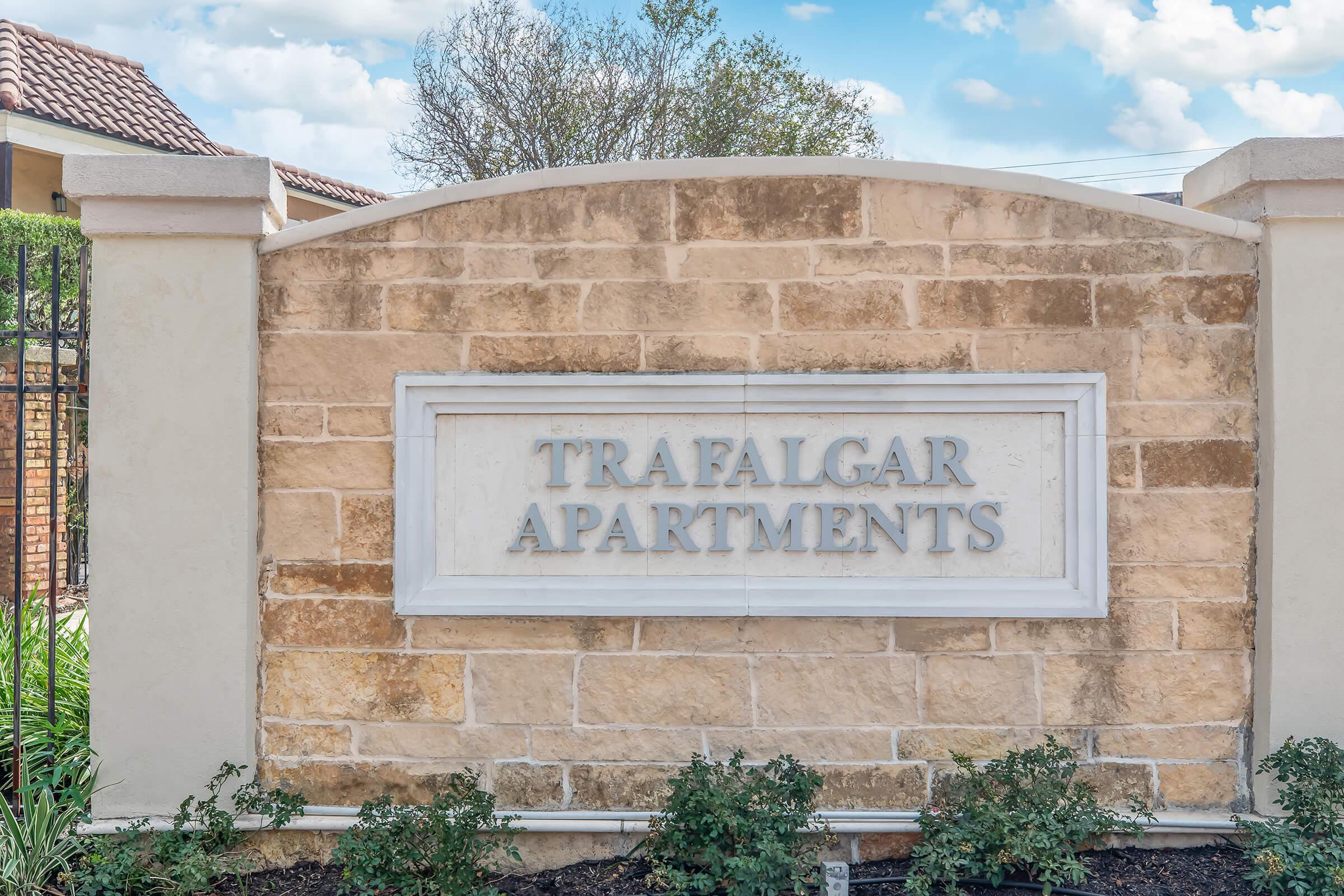 a sign in front of a brick building