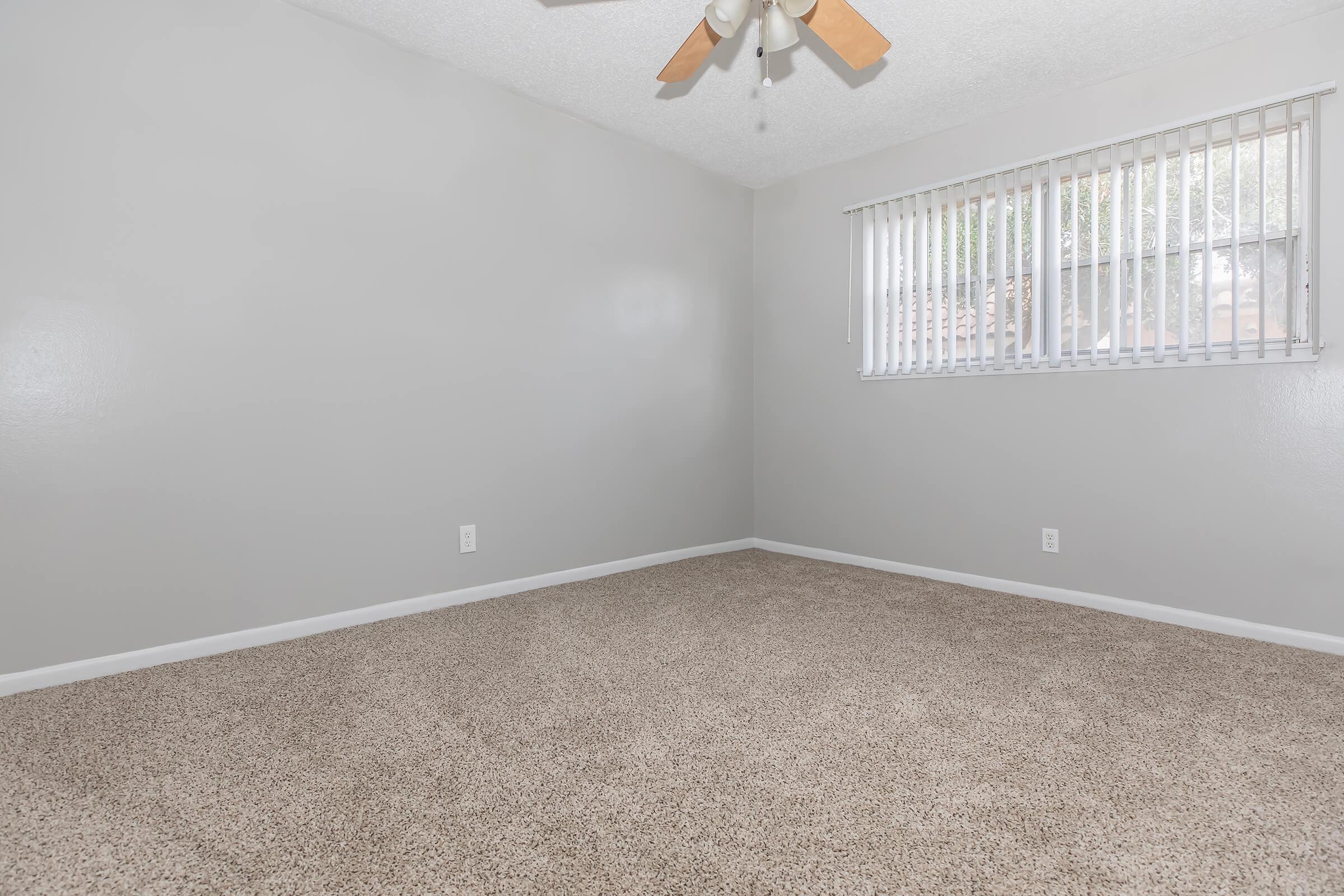 a bedroom with a large window