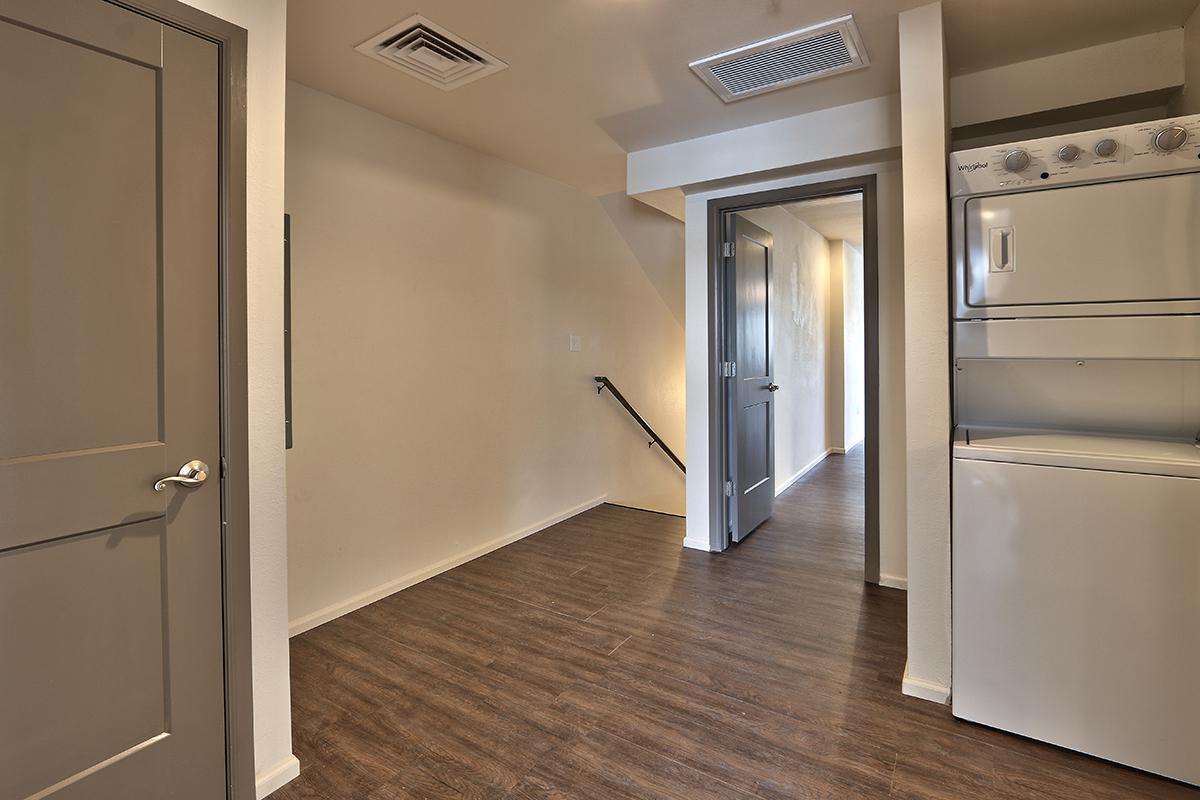 a stainless steel refrigerator in a room