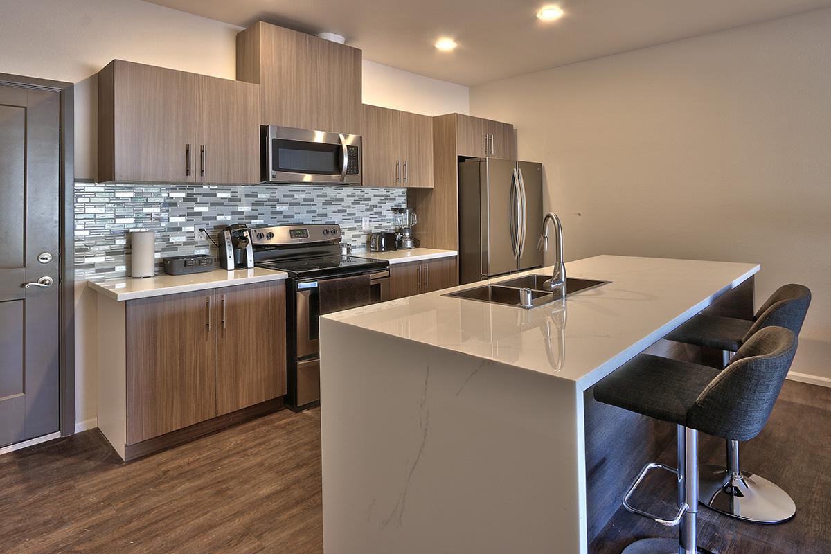 a large kitchen with stainless steel appliances