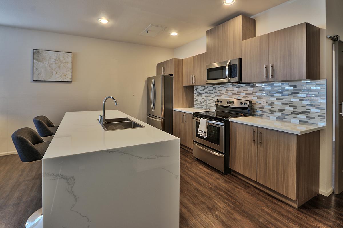 a modern kitchen with stainless steel appliances