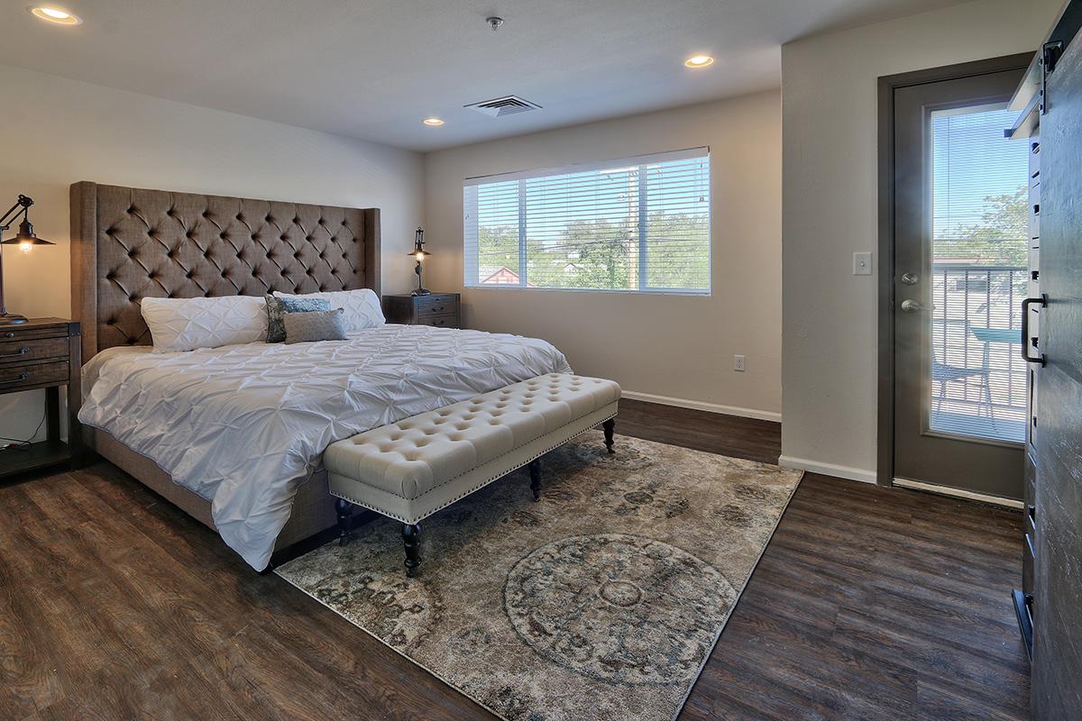 a bedroom with a large bed in a room